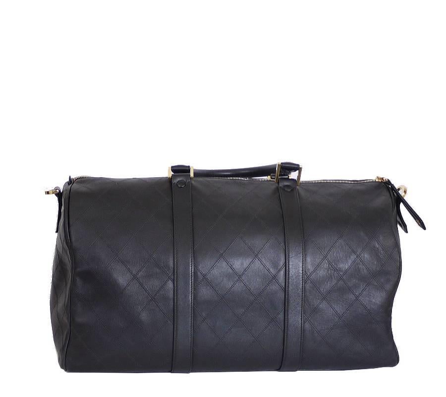 Chanel black lambskin flat quilt duffle carry-on bag. Comes with the detachable shoulder strap. Light weight, easy to carry luxury CHANEL travel bag. A perfect bag for daily or overnight traveling.

    Main color : Black
    Material : Lambskin
   