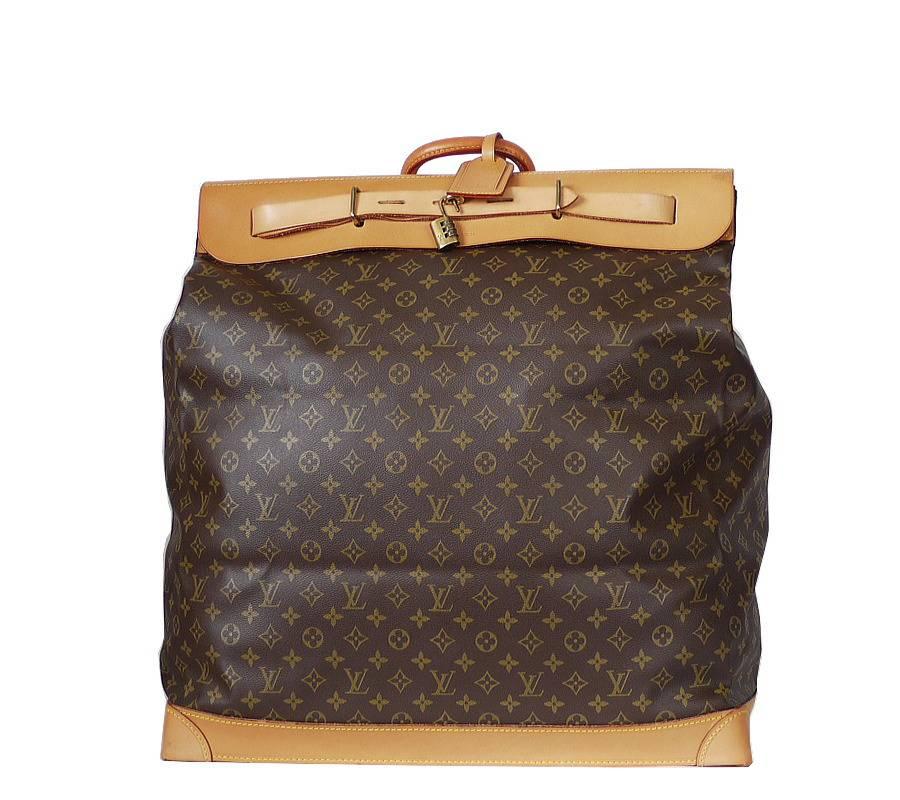 

Louis Vuitton Monogram Steamer Bag 55 Travel Bag in excellent condition. Special order item. This travel bag in Monogram Canvas offers a large storage space. Its base features protective feet and a leather strap makes its closure more secure.  You