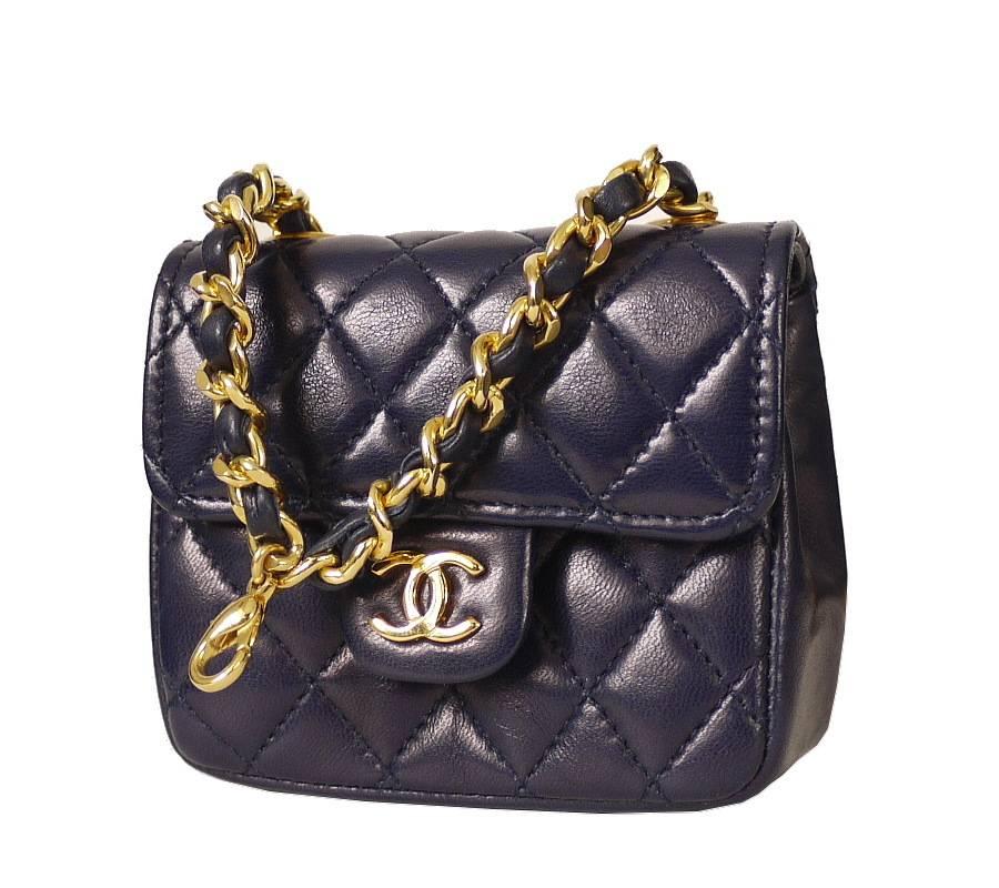Vintage Chanel chain belt with micro mini classic. Chain belt is size adjustable and can be worn as necklace. This perfect miniature version of the original 2.55 bag is removable, and can be attached to the chain on your other Chanel handbags as bag