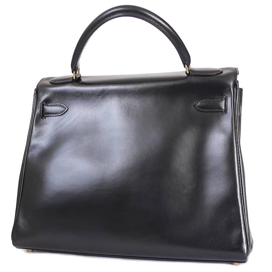Hermes box calf Kelly bag 32 gold  hardware. Gently worn, well cared beautiful bag. Manufactured in 1995. With its fabulously feminine shining box calf leather, this chic black color kelly32 handbag  is set to become (and stay) your favorite