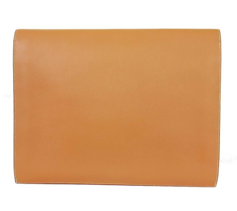 Vintage Hermes over-sized clutch bag in gold. Gold couchevel leather with white stitching. Bag opens widely. There 2 wide spacy compartments inside the bag. You can use the bag as clutch or document case. 

    Main color and Material : Gold,