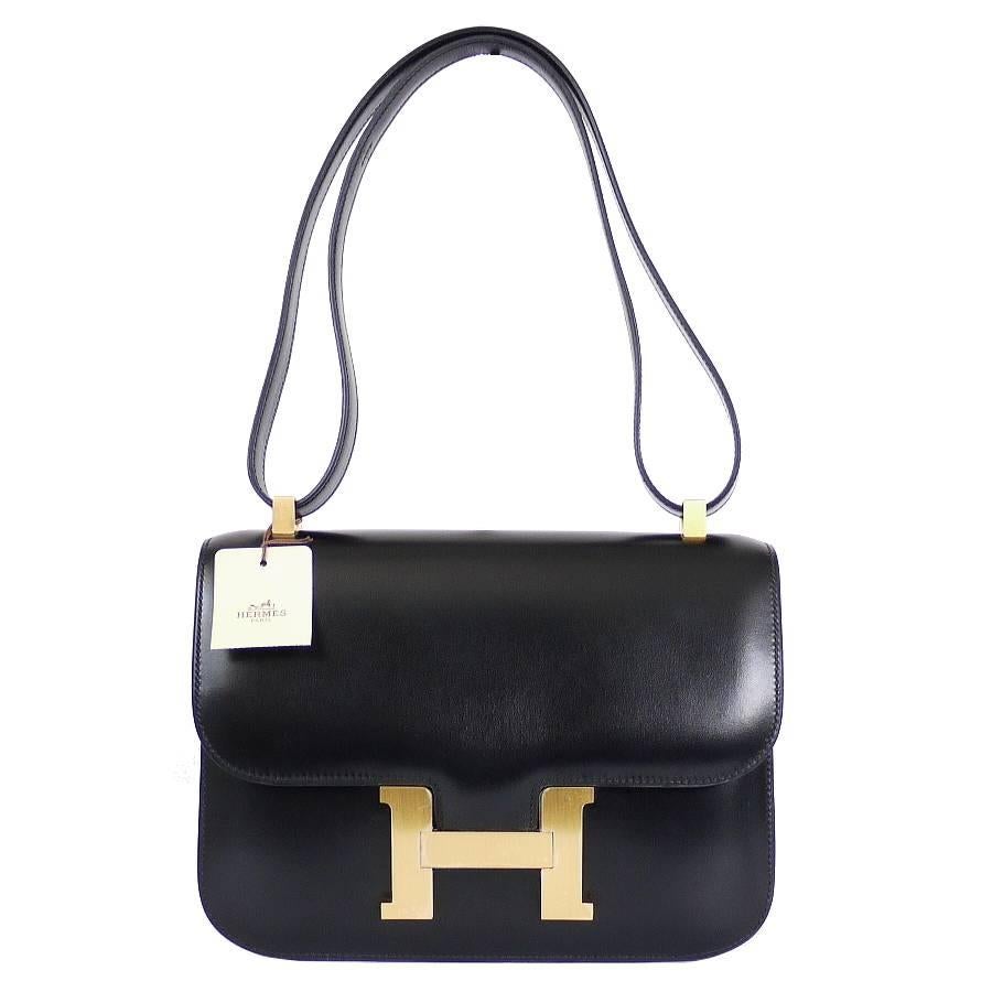 Hermes Box Calf Constance 23 flap bag. Never worn with tag. This bag is unused bag which had been kept for display purpose. H logo closure still have protective sticker. Great condition from year 2005. Complete set in box. If you want to see more