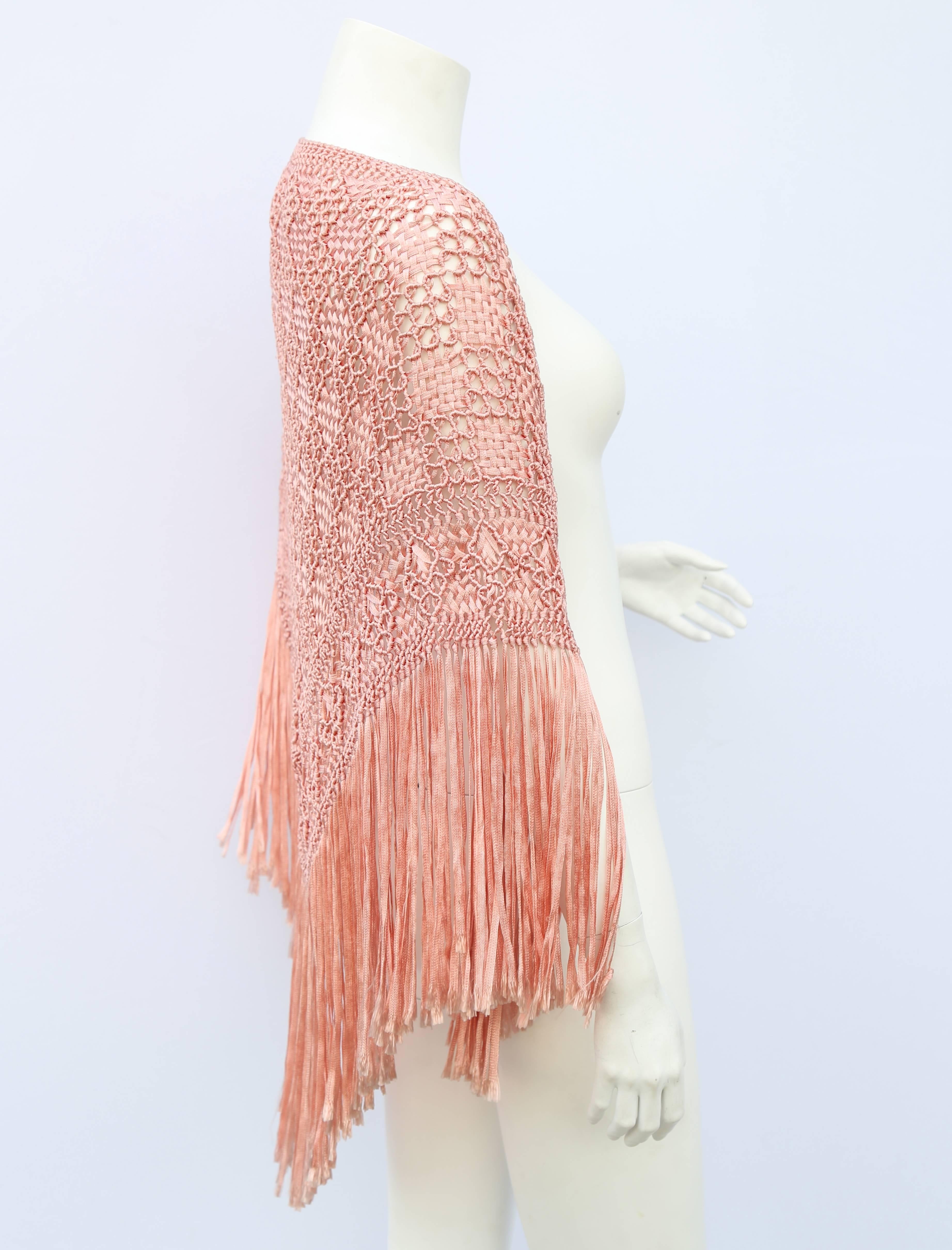 A vintage 1920s pale pink woven ribbon work shawl with ribbon tassels

Measurements taken flat in inches
Length - 45
Length – 20
Tassle length - 10