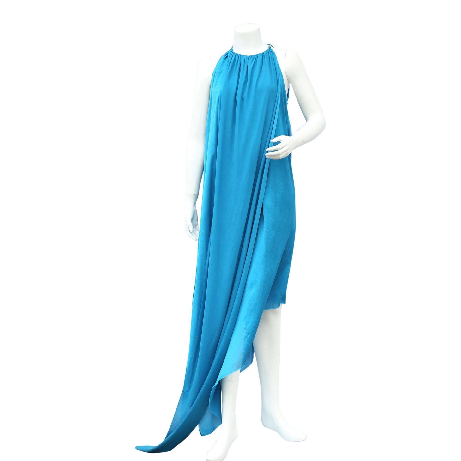 Lanvin Electric blue silk dress with ring neck that hocks on the side with a sliver clasp and falls to the floor, which is cut on a angle. 

Measurements taken flat in inches
Bust – 19
Waist – 29
Hips – 33 
Length on main hem  57
Length on