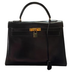 Sac Hermès Kelly 32 box noir 1956