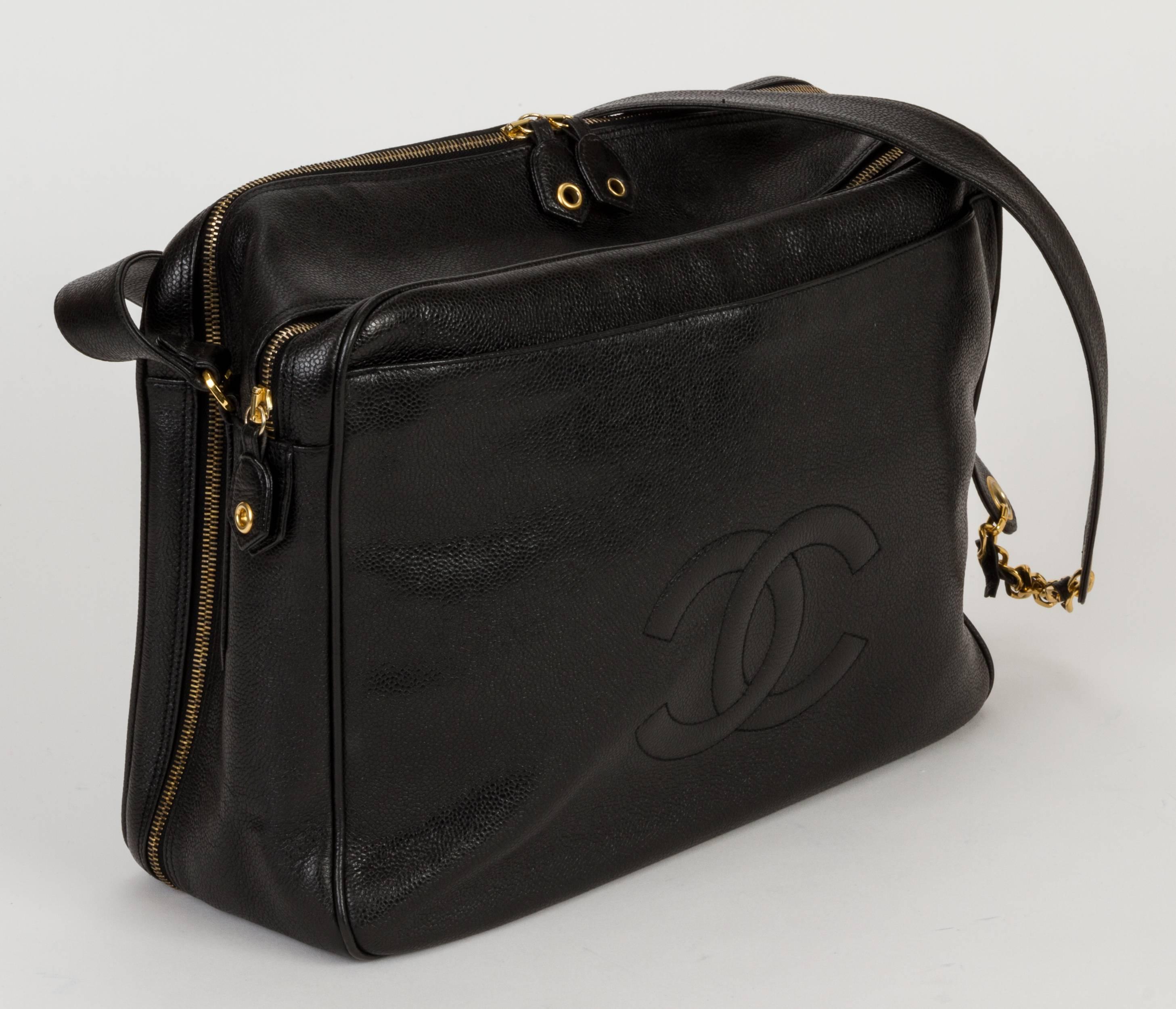 1990s Chanel computer bag/shoulder document bag. Excellent condition for very durable black caviar leather with gold-plated hardware. Comes with original padlock, keys, key holder and original dust bag.
