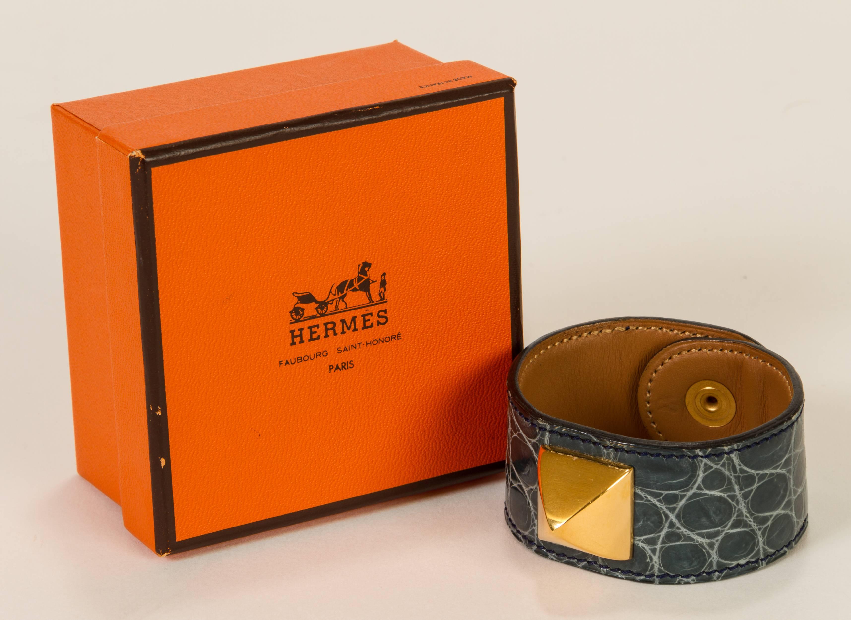 Hermès Medor bracelet with snap clasp, 1993. Made with crocodile leather, in excellent condition. Size W. Comes with original box.