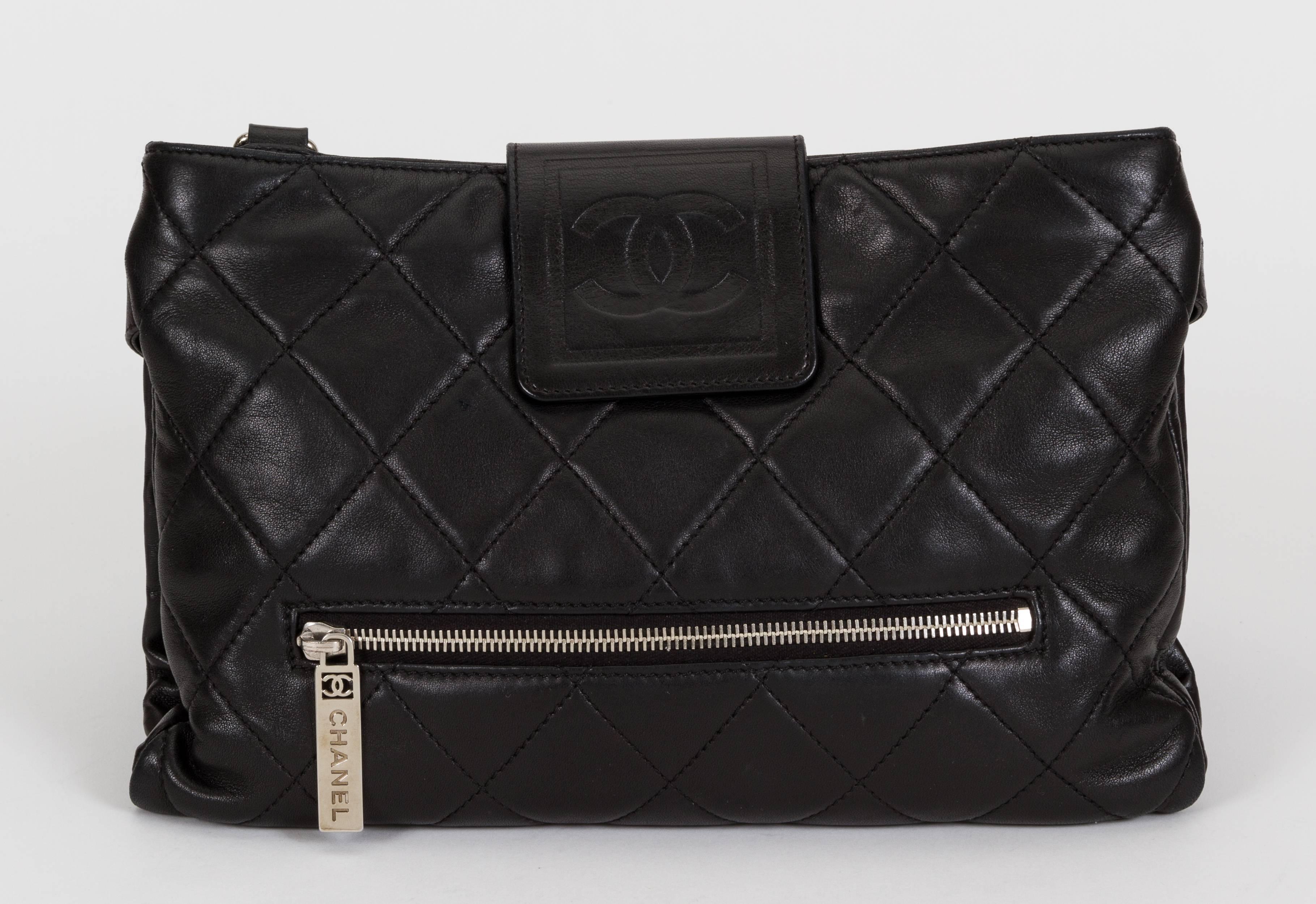 Chanel black lambskin quilted cross body bag. 5 zipped compartments. The bag opens flat with two snaps. Collection 2008/2009. Comes with hologram and id card. Minor wear.

