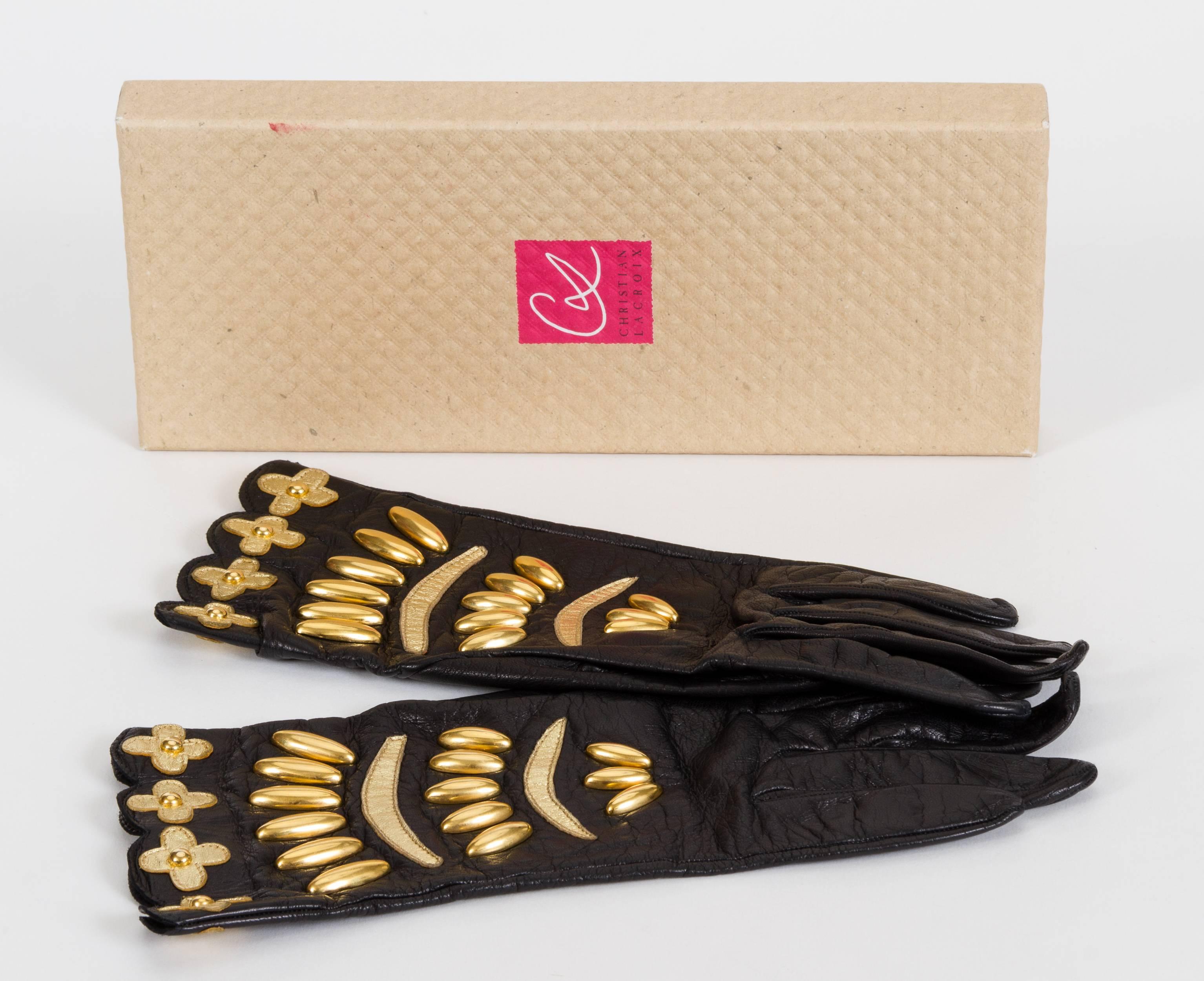 Christian Lacroix 80's collectible black leather gloves with gold beading and leather flowers. Size 7. Come in original box.