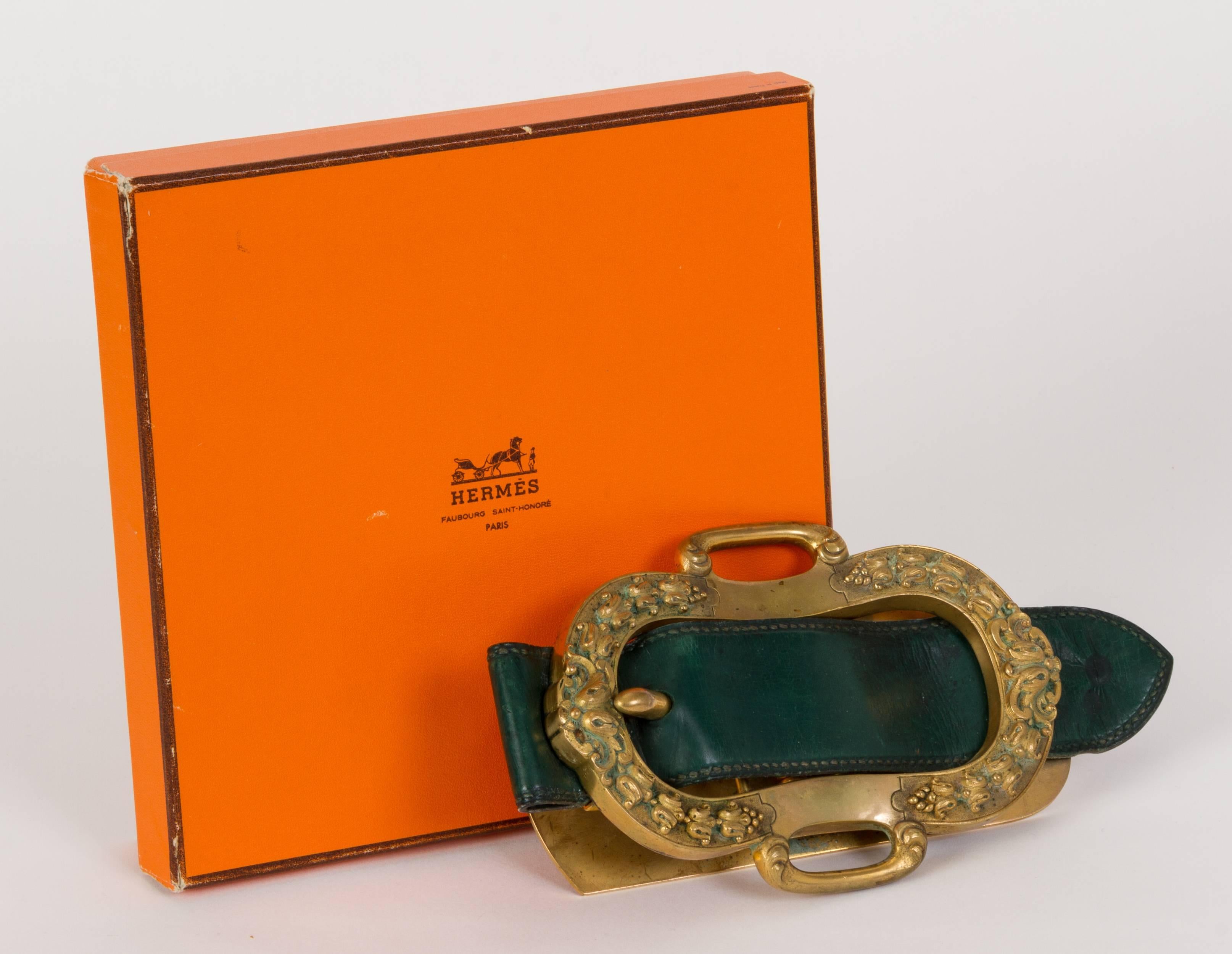 Hermès rare oversize paperweight/mail clip. Forest green leather and brass metal. Stamped. Comes with original box.
