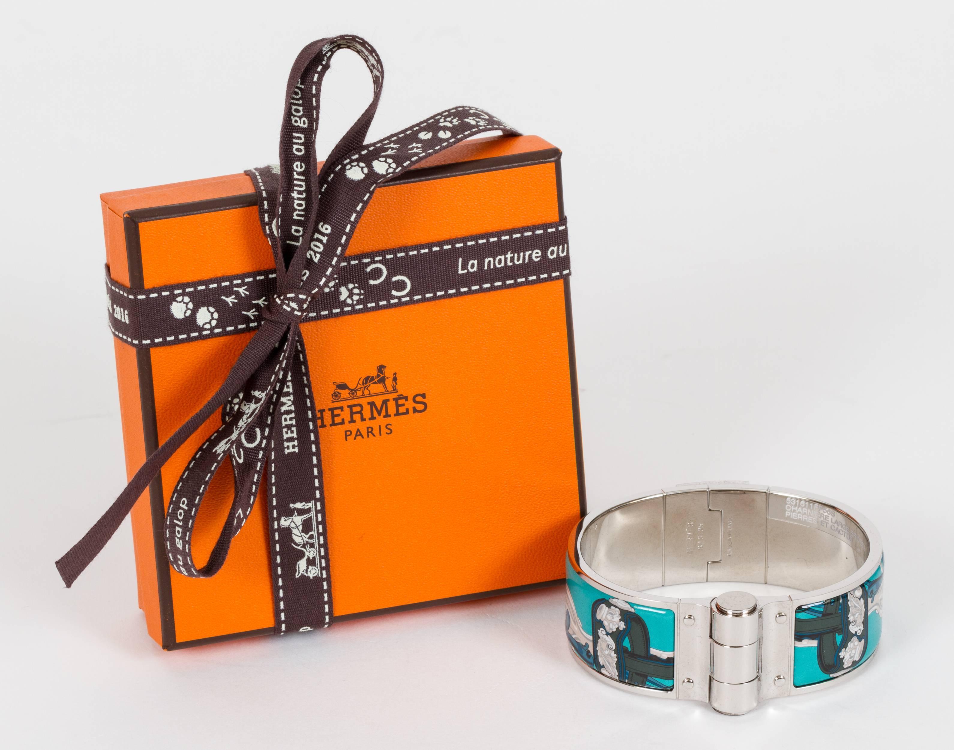 Hermès enamel hinged cuff bracelet. Brides de gala new collection. Size small. Comes with original velvet pouch, box, ribbon and gift bag.