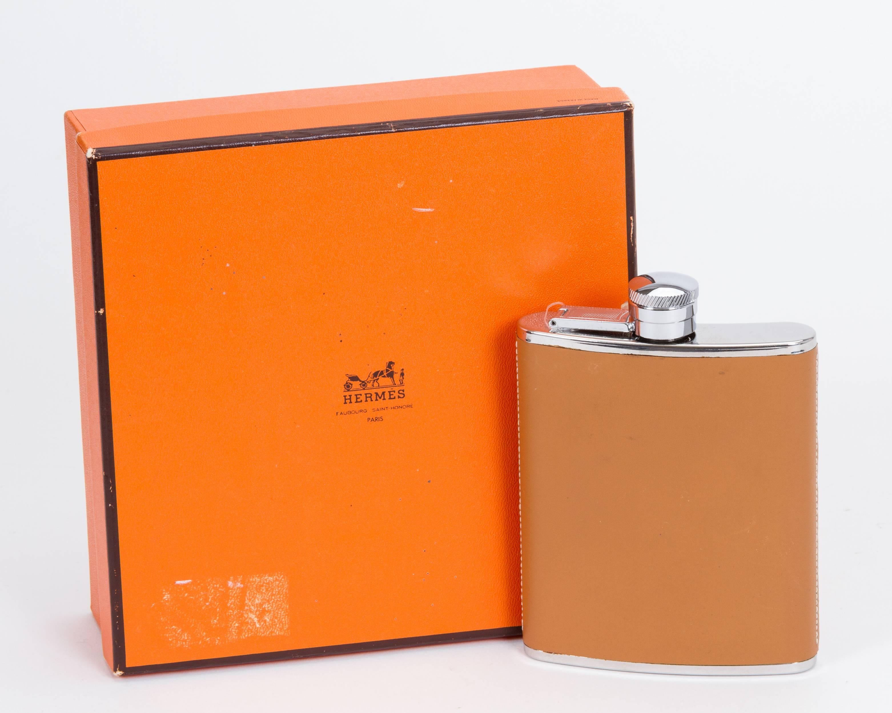 Hermès brand new in box whisky flask covered in box leather. Winter 96 collection. Comes with original tag, box and ribbon.
