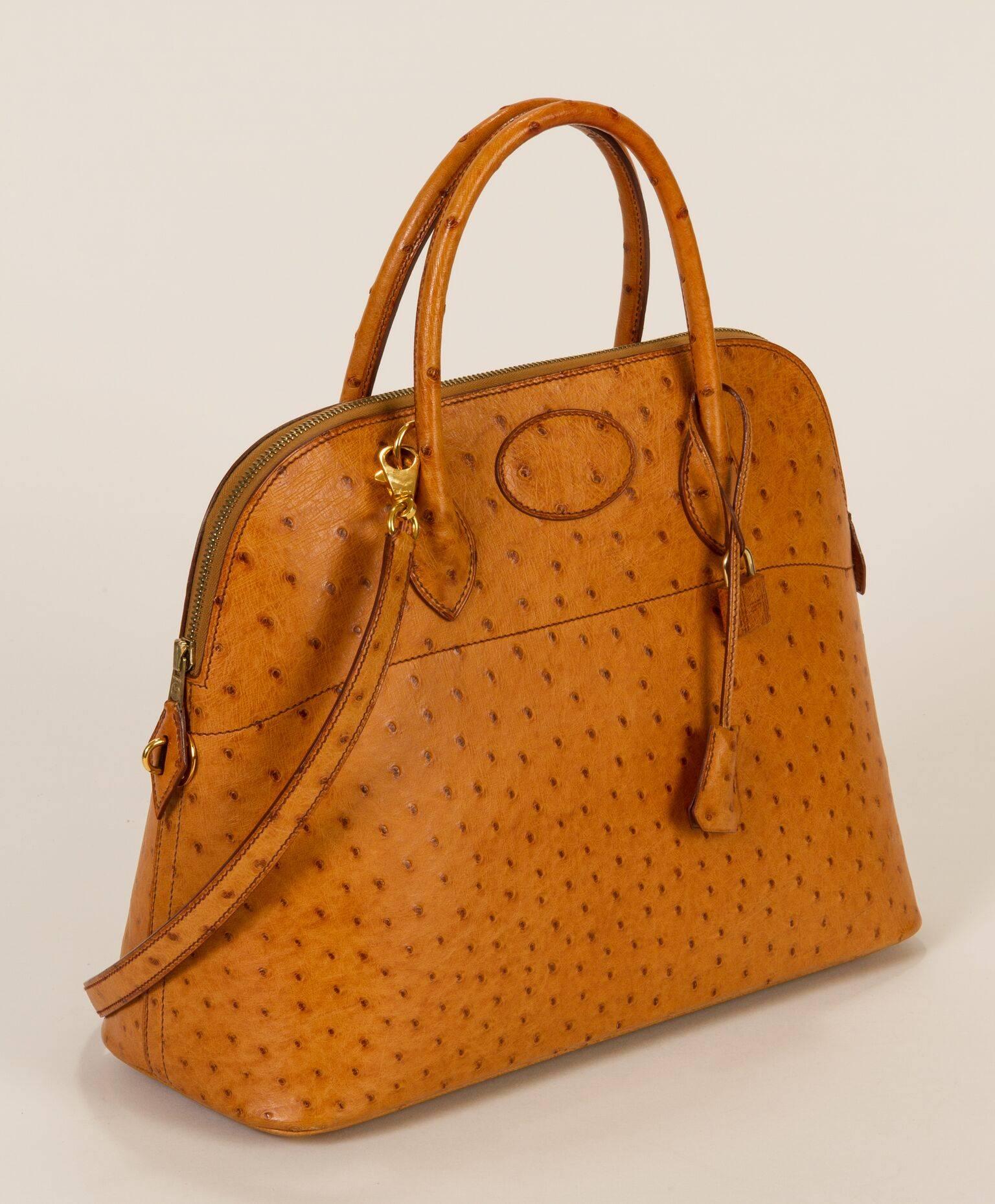 Hermès chestnut 35cm ostrich Bolide bag. Gold hardware. Comes in duster, with lock, key and optional chain strap. Leather interior with pocket. Comes with box. Date stamped circled Z for 1996. Handle drop, 4