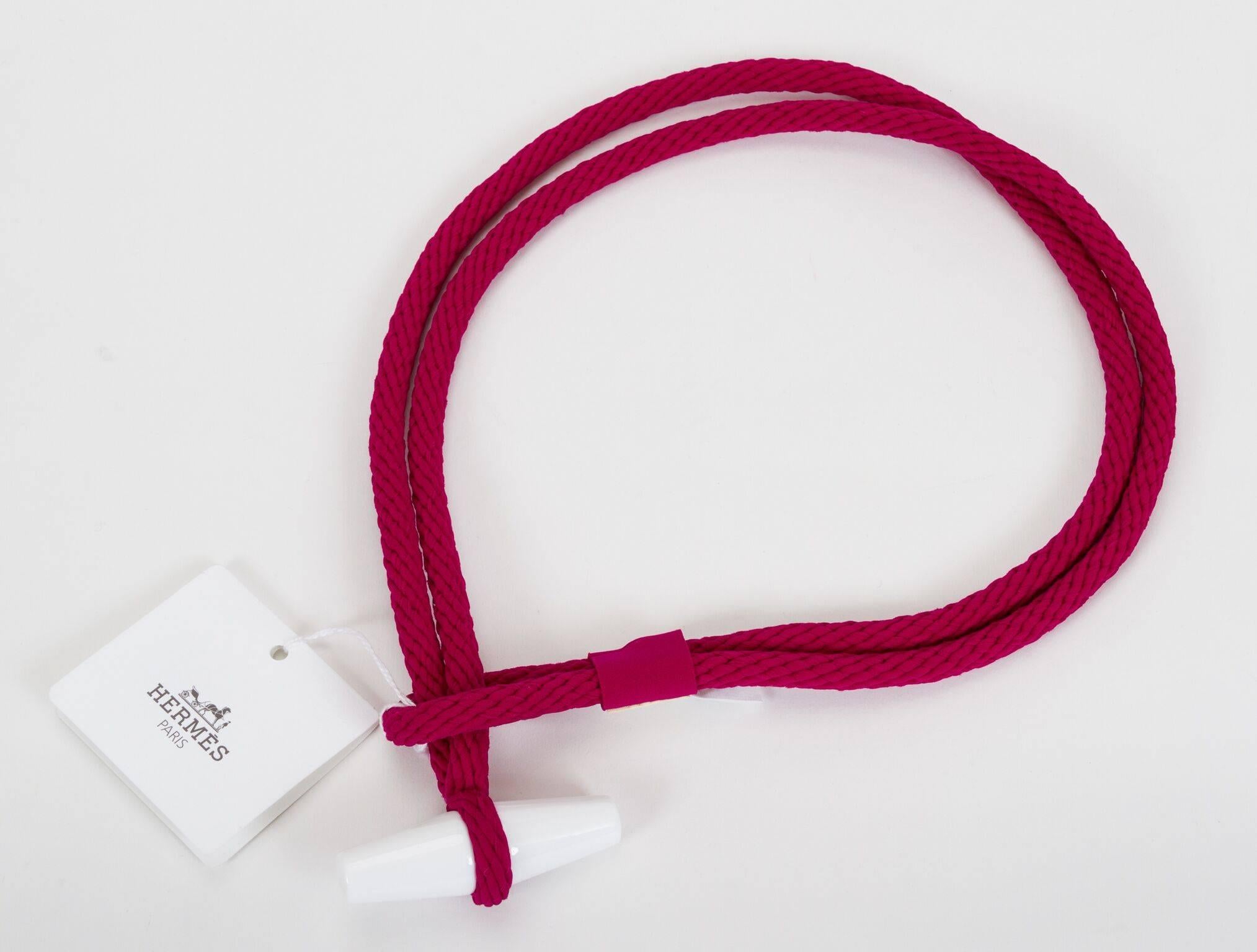 Hermès tricot belt, rouge pourpre and white resin toggle. Brand new with tag. Size small.
