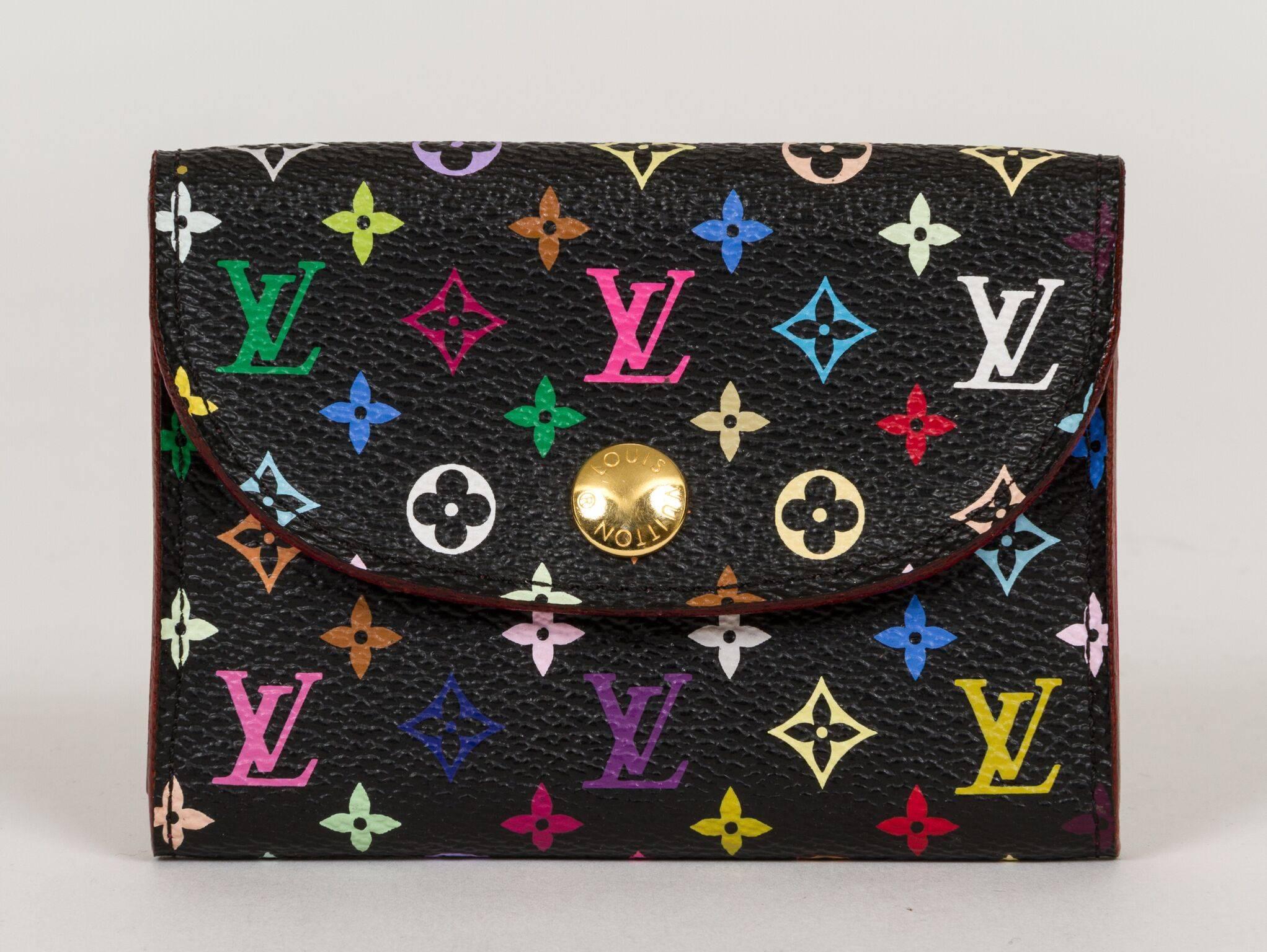 Louis Vuitton Murakami limited edition coin wallet. Multicolor black exterior and hot pink interior. Mint condition.