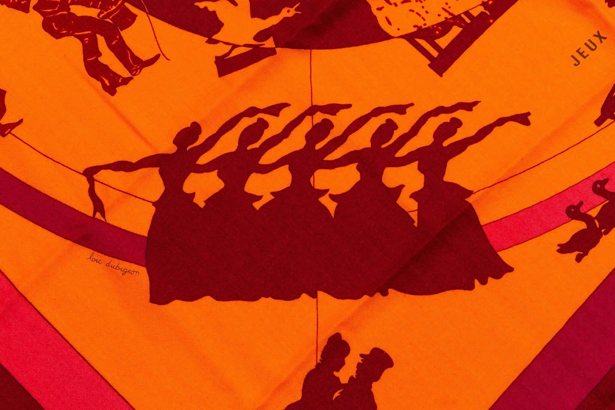 Hermes cashmere and silk blend 55" square oversize scarf shawl in the red and orange Jeux D' Ombres print. Hand rolled edges. Previously worn in great condition. Does not include box. 