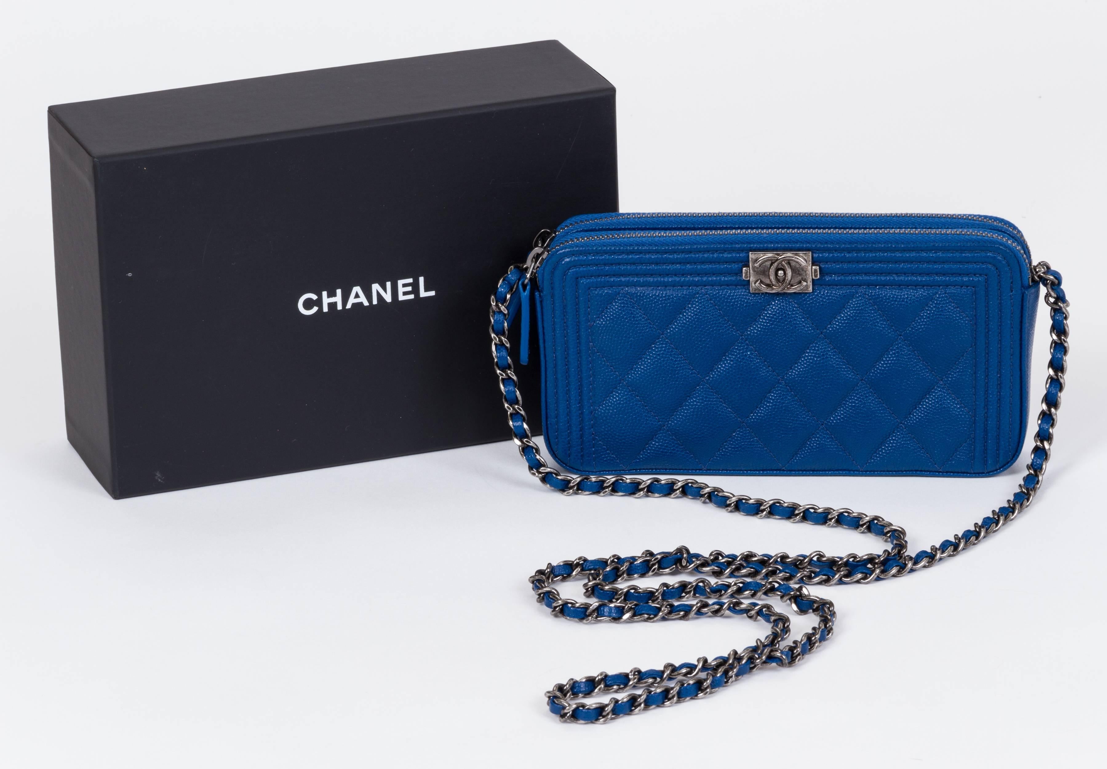 Chanel brand new in box new style wallet on a chain. Two zipped compartments and one center open to place your phone (phone in photo is not included). Comes with hologram, ID card, dust cover, box and ribbon.