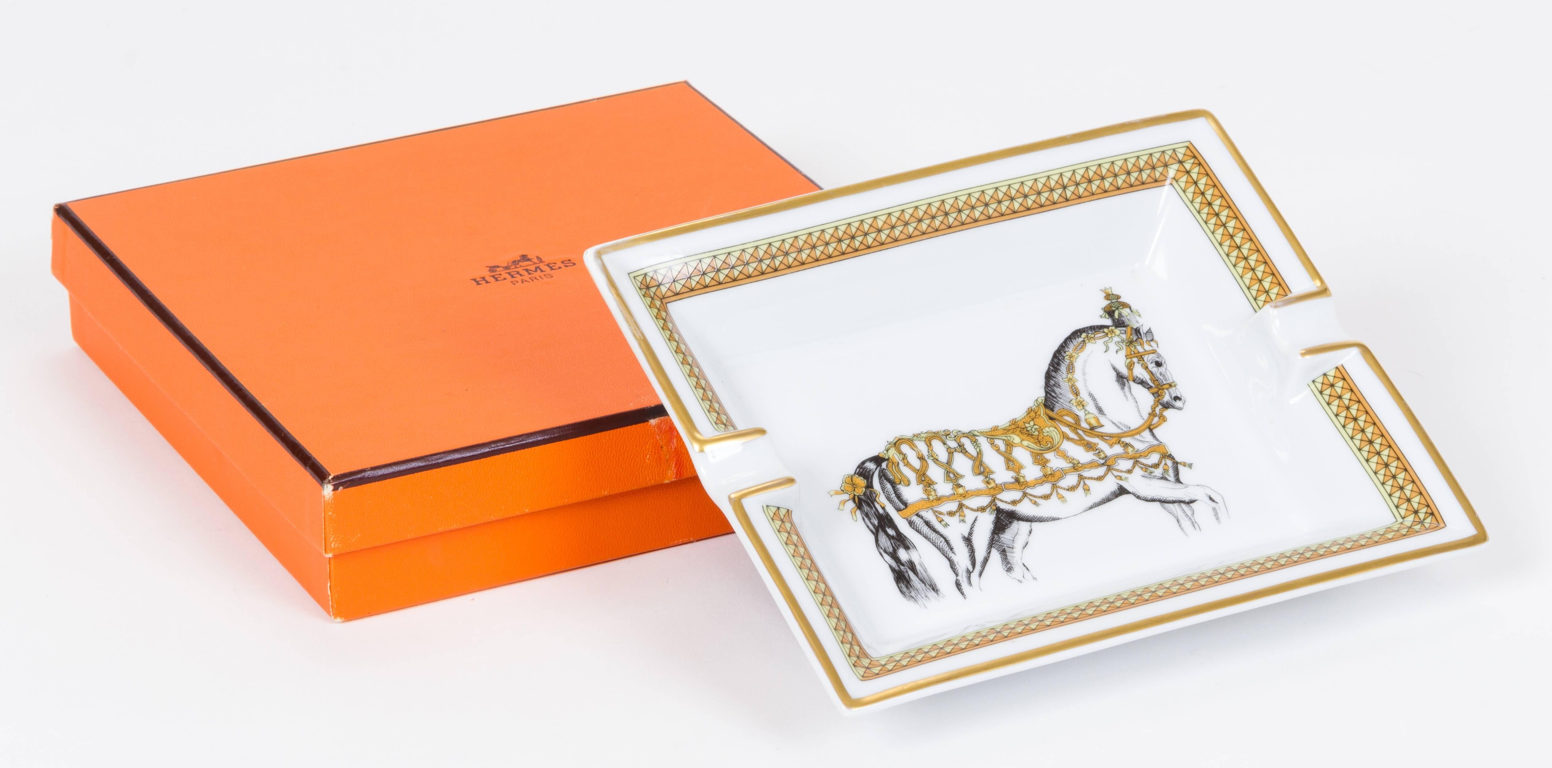 Hermès porcelain ashtray with horse design. Made in France. Minor wear. Comes with original box.