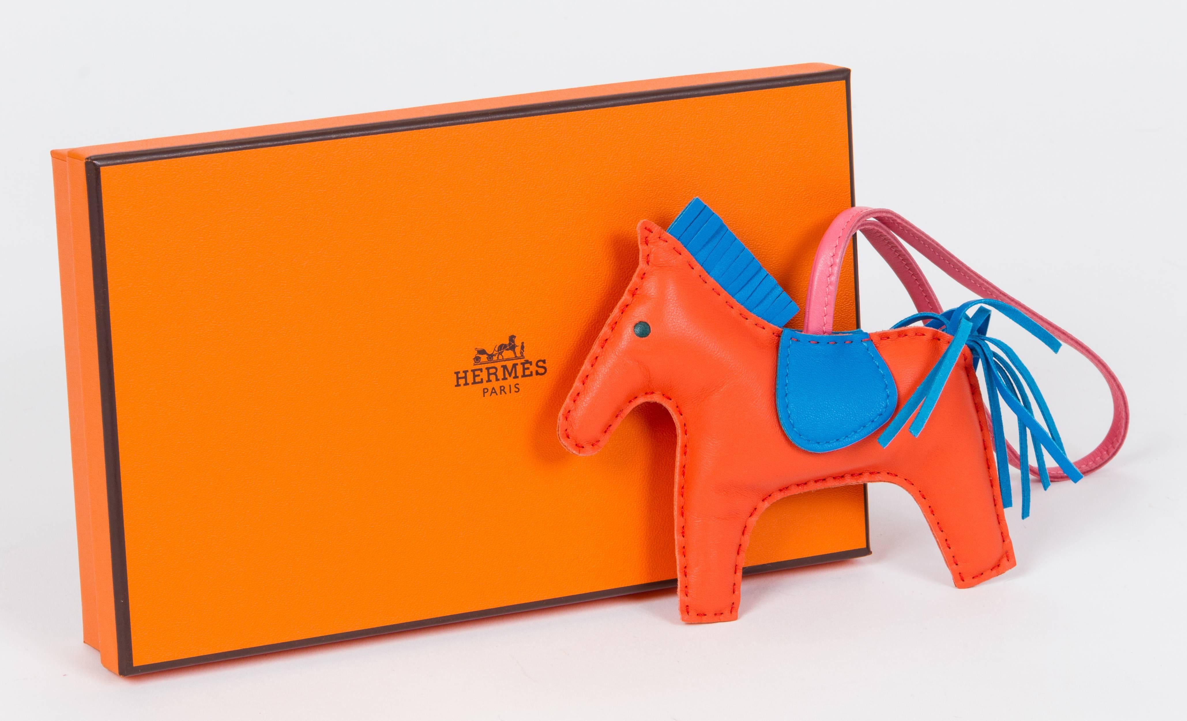 Hermes rare and collectible grigri rodeo bag charm MM (medium). Combination of rose azalea, orange poppy and blue Izmir. Brand new in box with ribbon and gift bag.