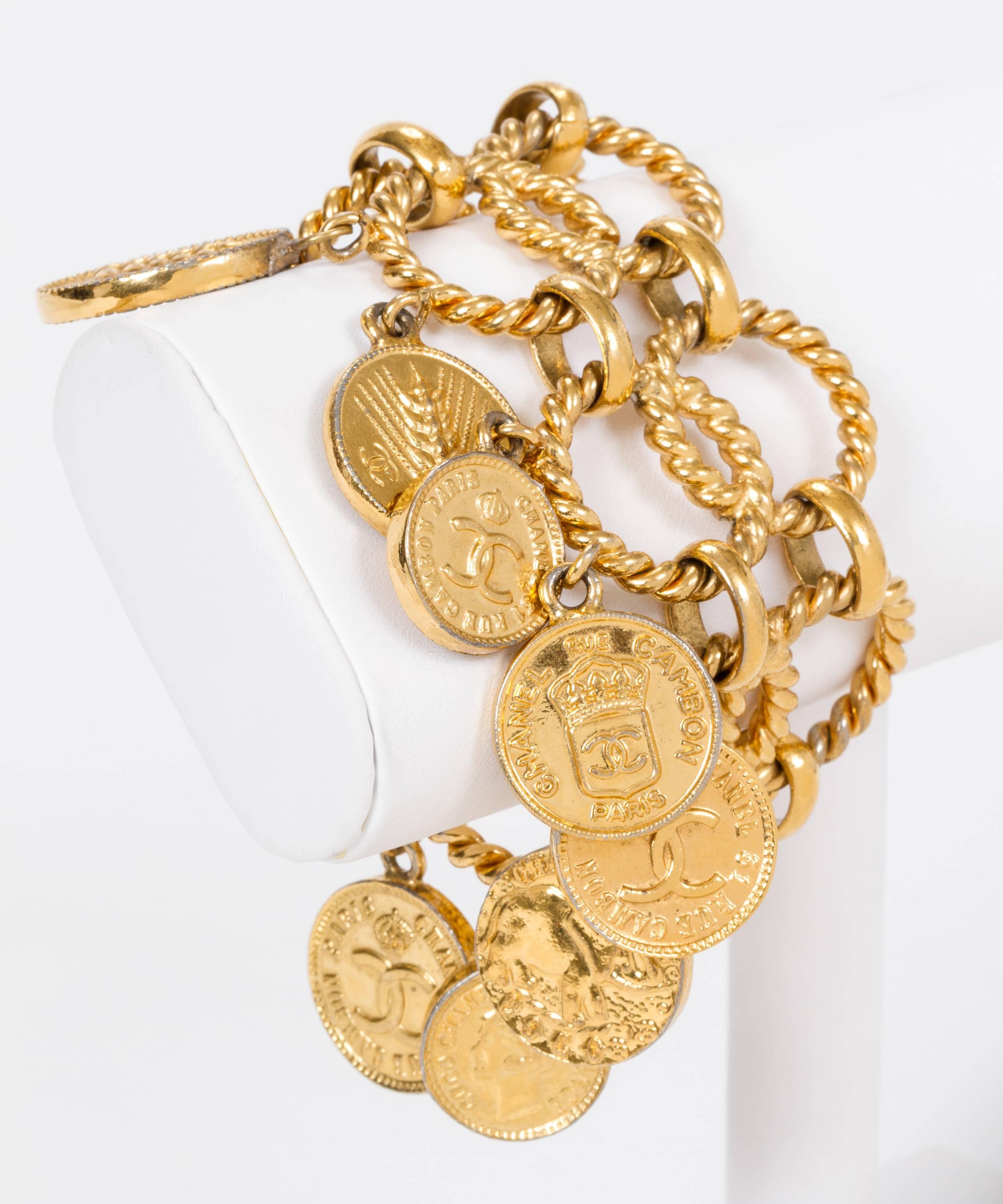 Chanel 80s double chain bracelet with roman coin charms. Collection 25 , mid 80s. Comes with original box.
