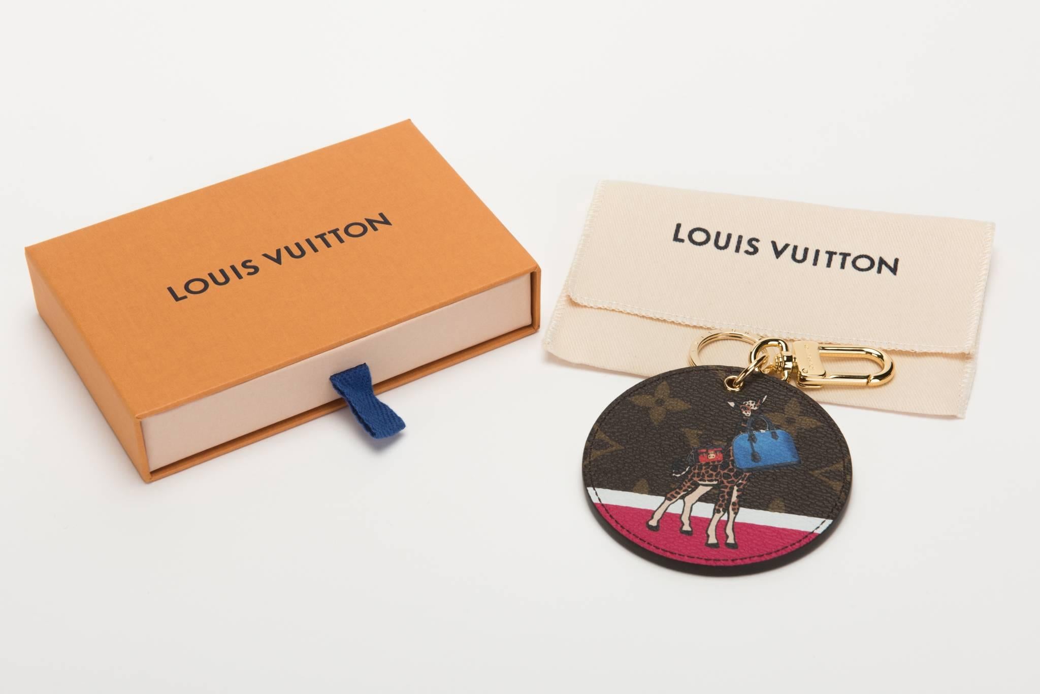 Louis Vuitton sold out giraffe Christmas collection keychain, bag charm . Comes with original dust cover and box.