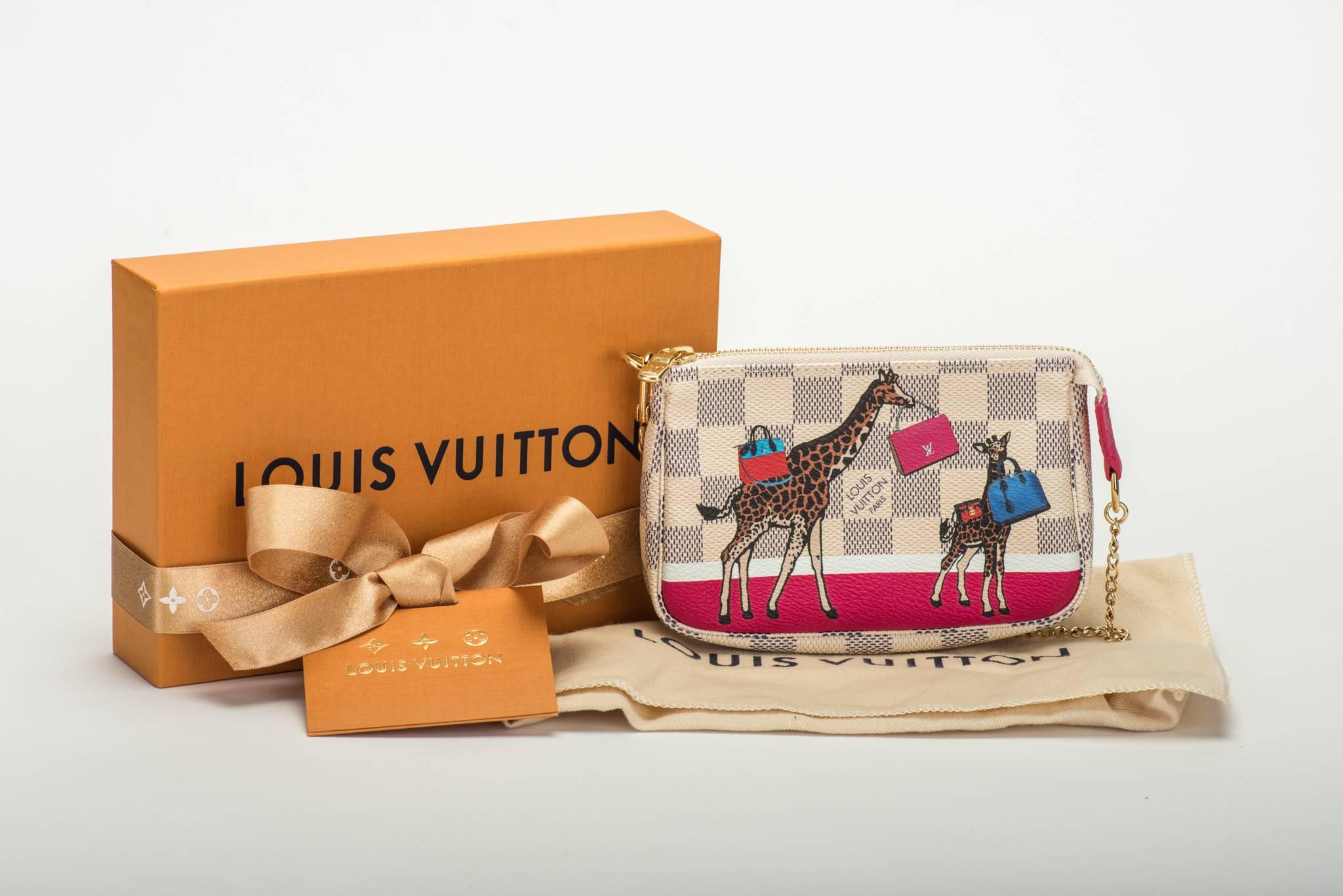 Louis Vuitton limited edition mini pouches admire azur with giraffe . Christmas collection. Brand new in box with original dust cover and ribbon.