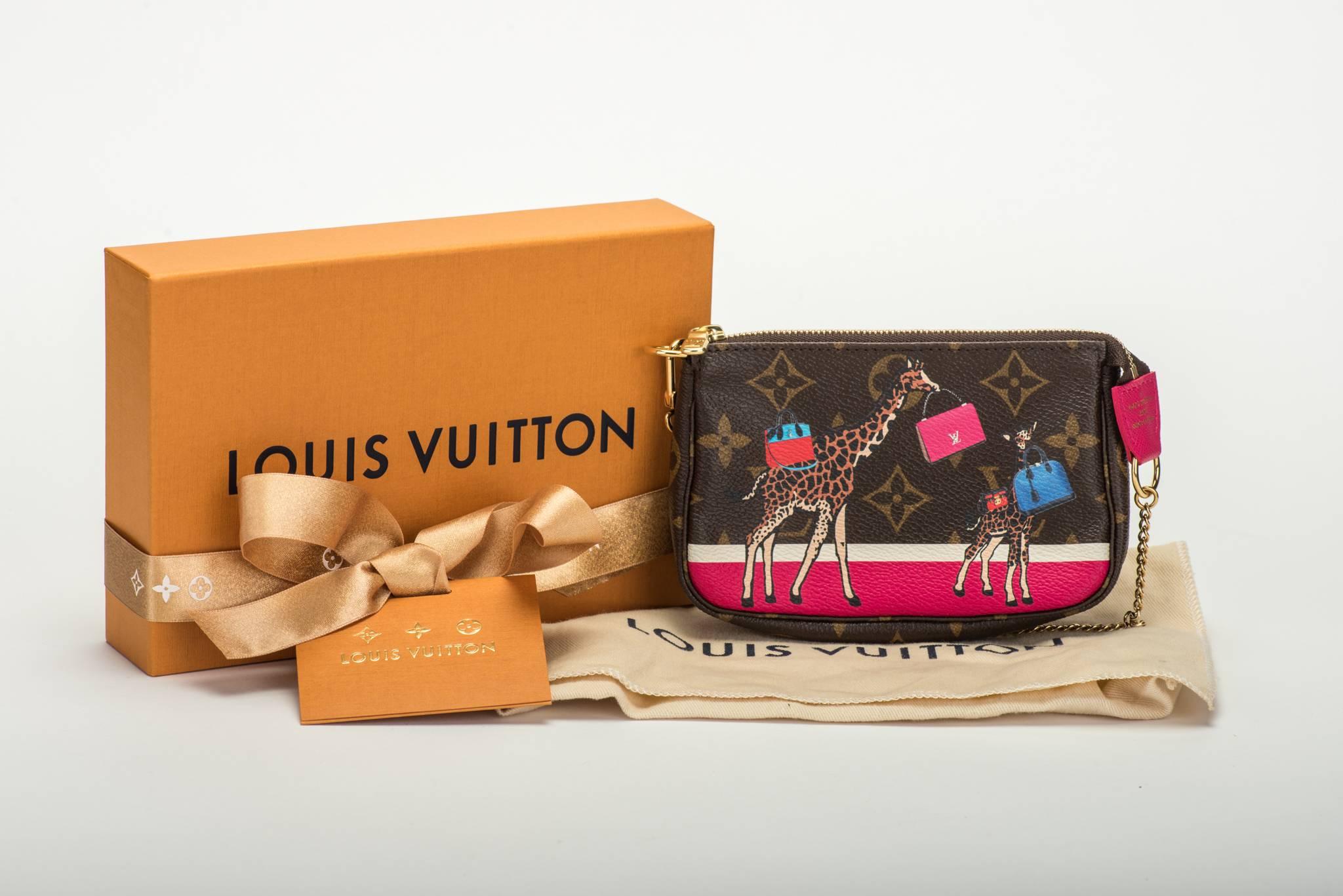 Louis Vuitton limited edition mini pouchette monogram with giraffe . Christmas collection. Brand new in box with original dust cover and ribbon. Sold out in LV stores. 