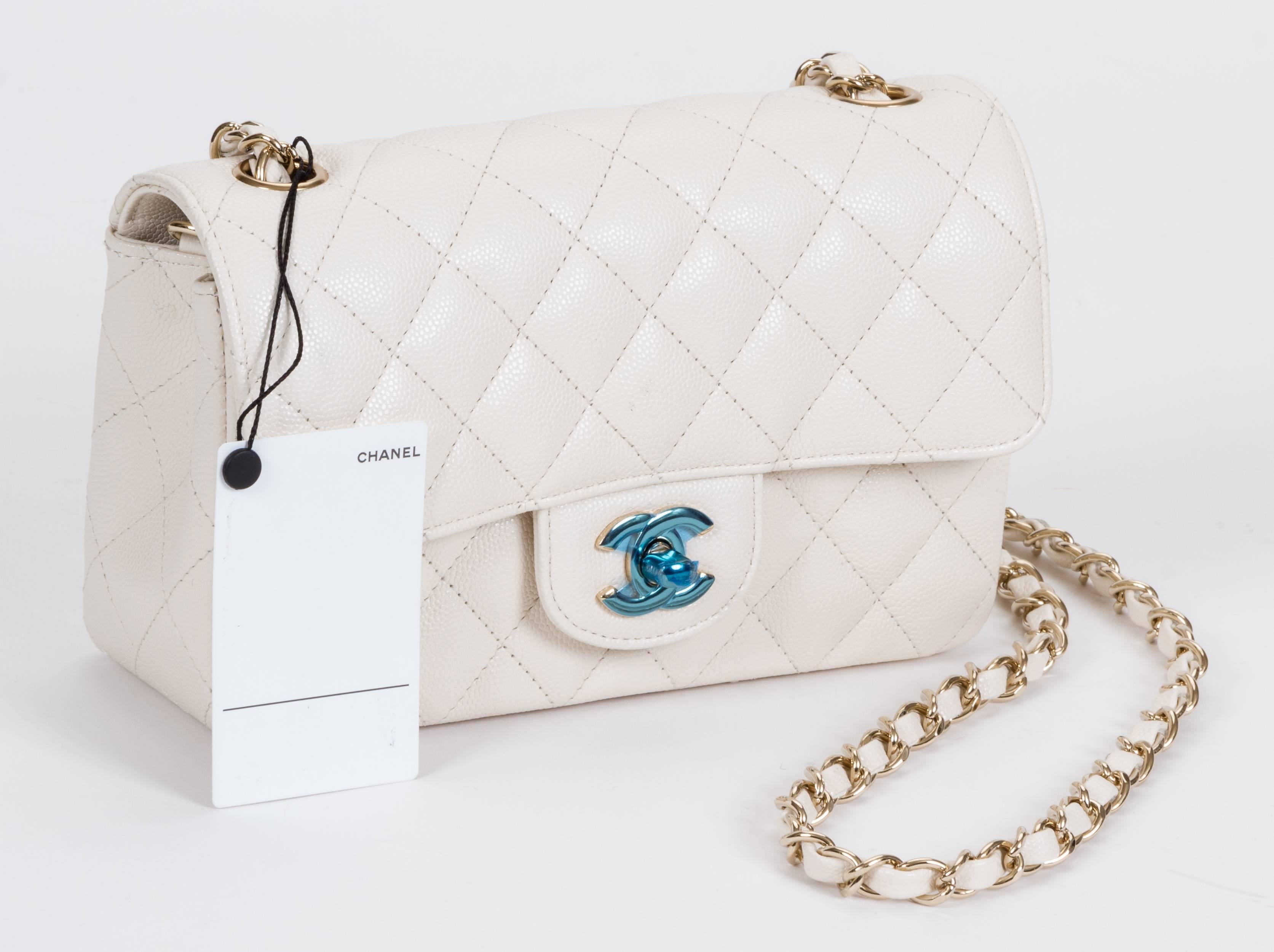 Chanel brand new mini cross body in white caviar leather with gold tone hardware. Plastic still on hardware. Shoulder drop 22