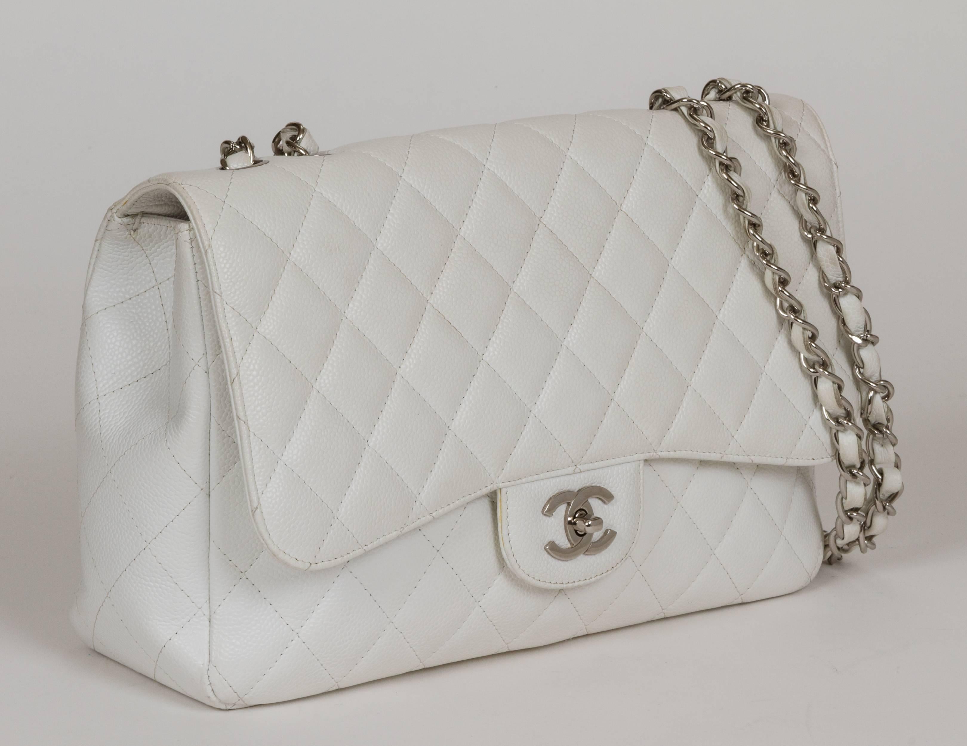Chanel single-flap jumbo classic. Durable white caviar leather and silvertone hardware. Double drop, 13