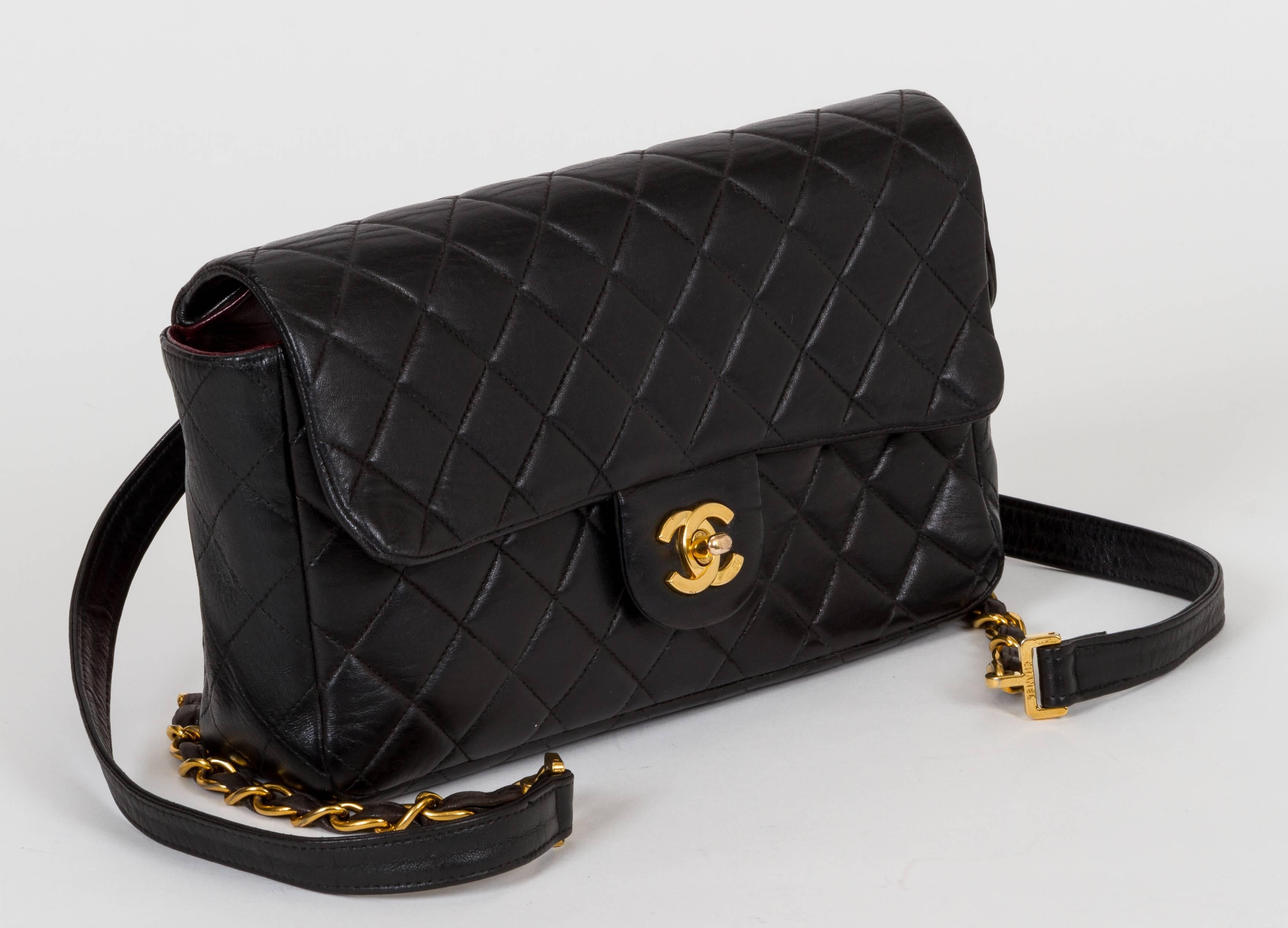 Chanel small black quilted backpack with zipped compartment and flap front. Includes hologram and dust cover. Minor wear on leather.