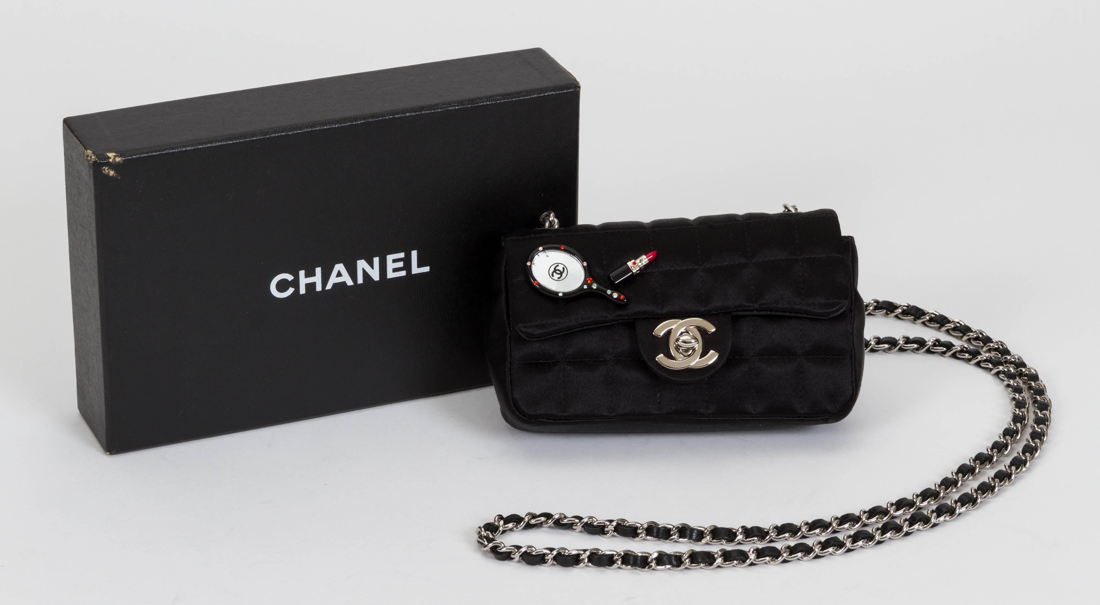 Chanel limited edition make up mini classic flap bag. Few small cracks in the mirror charm. Can be worn cross-body; shoulder drop, 23