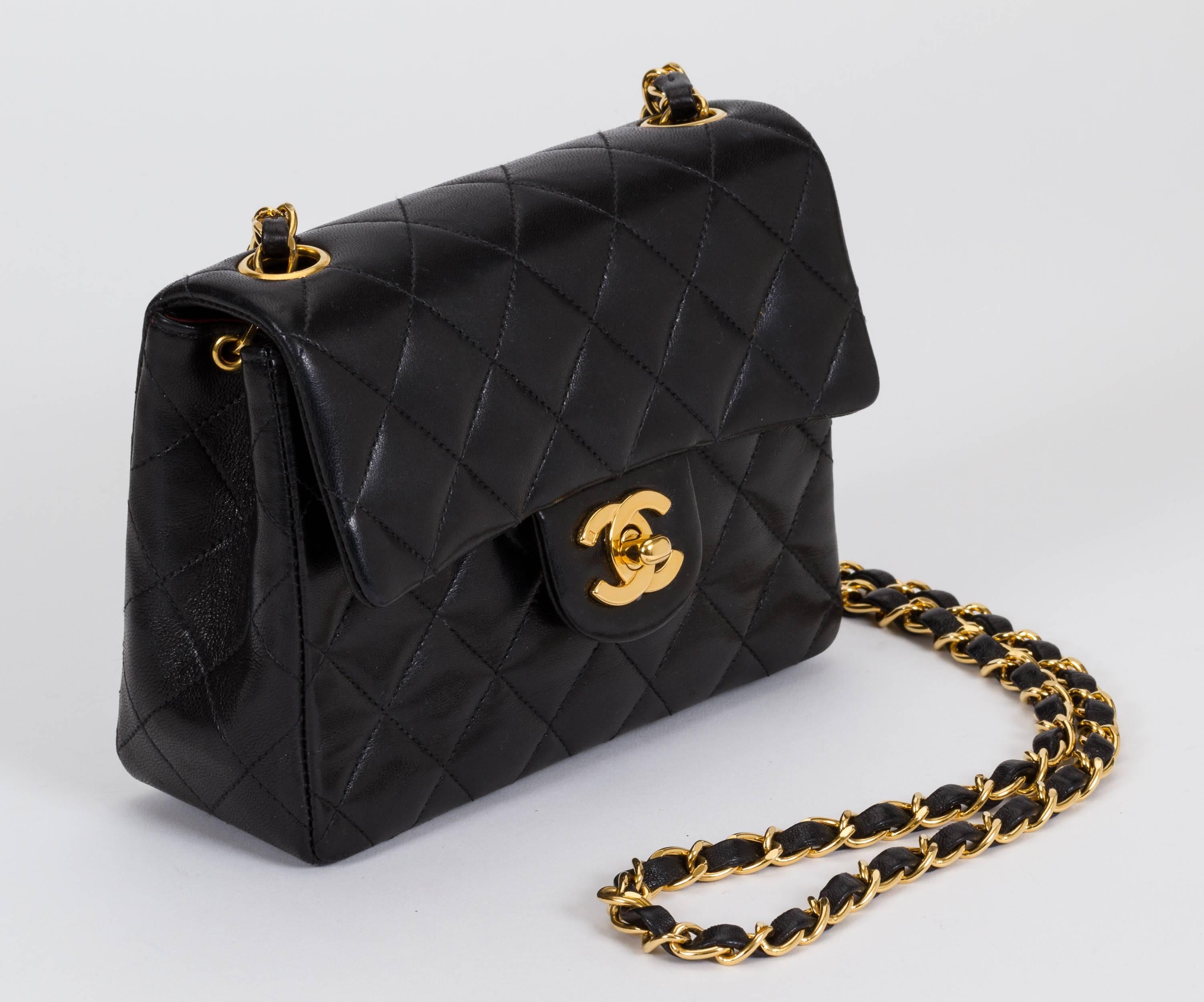 Chanel classic small single flap purse in black lambskin with gold tone hardware. Can be worn cross body.  Shoulder drop, 22
