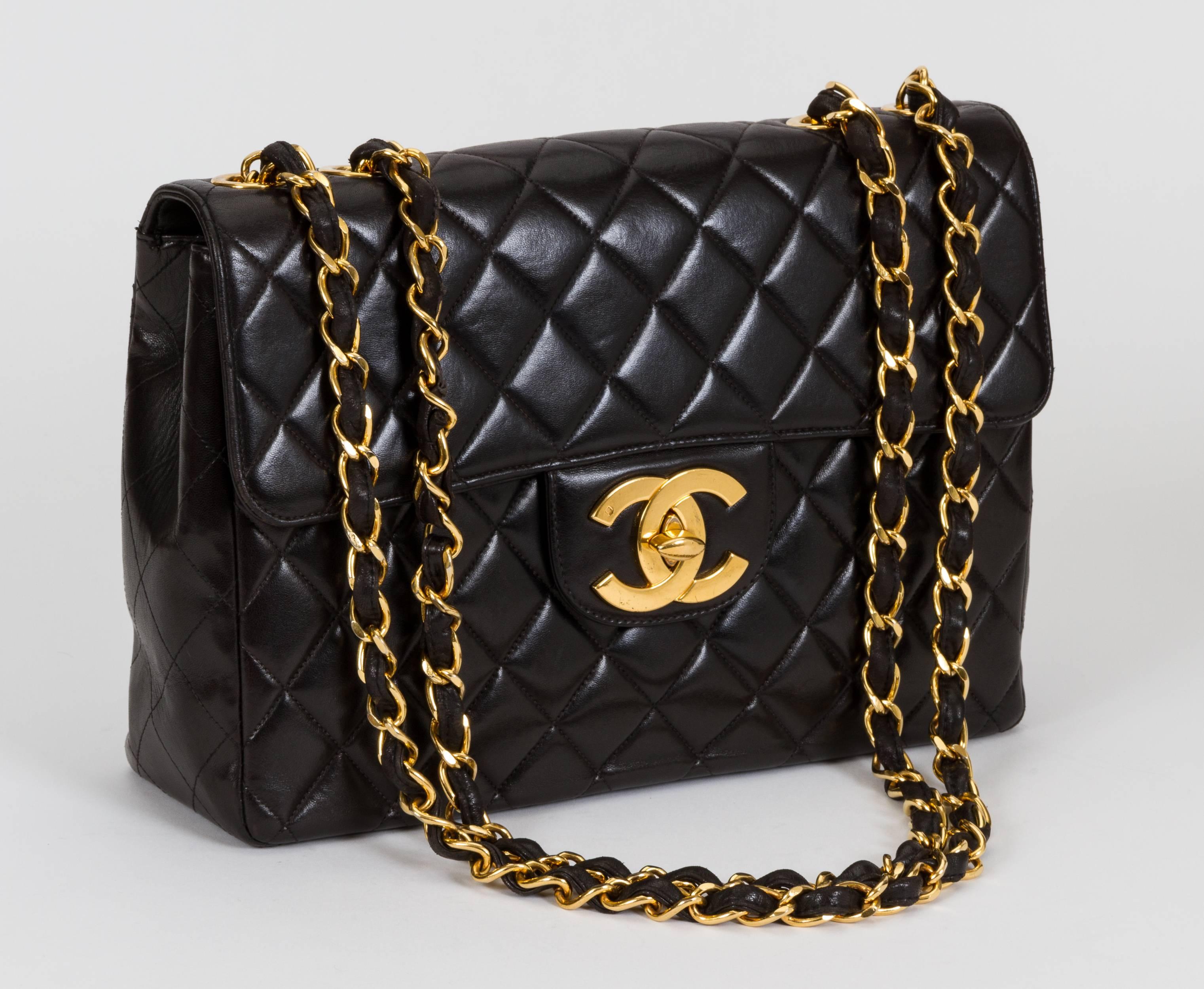 Vintage Chanel black quilted lambskin jumbo single-flap bag. Signature oversize CC logo turn-lock clap. Black leather interior. Very good condition. Can be worn with strap long, 25