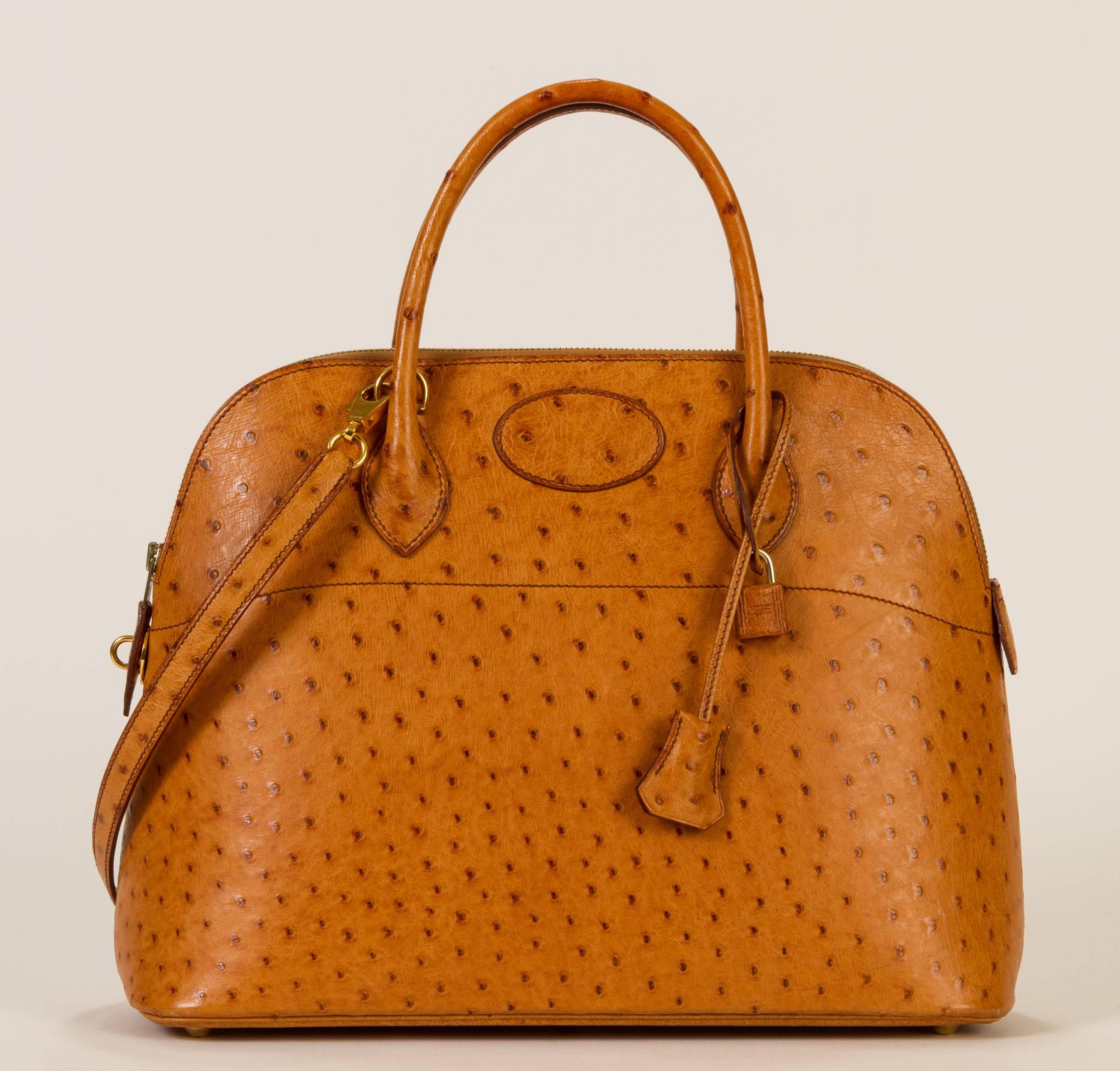 Hermès chestnut 35cm ostrich Bolide bag. Gold hardware. Comes in duster, with lock, key and optional chain strap. Leather interior with pocket. Comes with box. Date stamped circled Z for 1996. Handle drop, 4