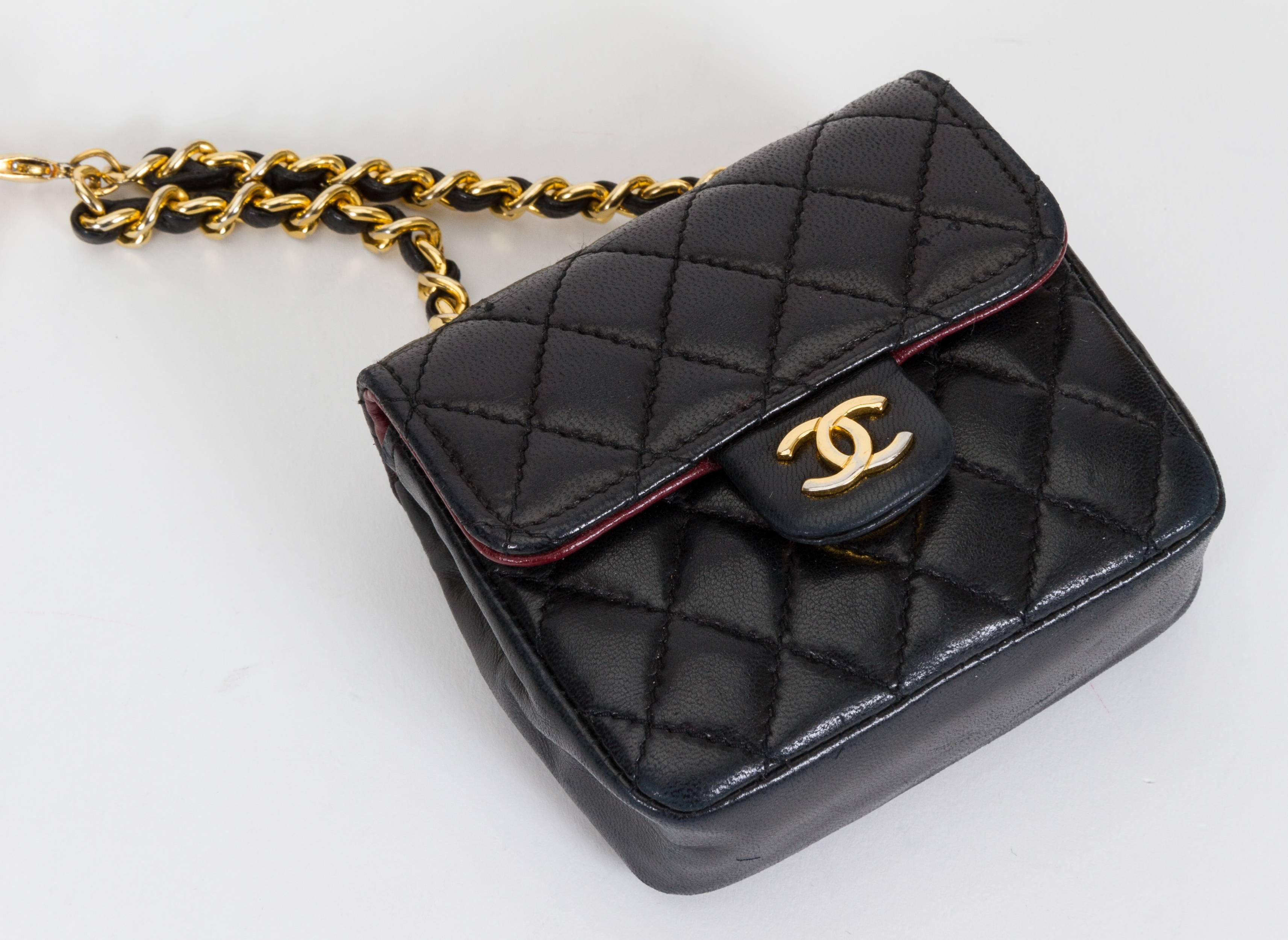 Chanel black leather quilted lambskin flap bag on gold plated chain belt, detachable bag. Very unique, hard to find and from the 1980's. Come with original box.