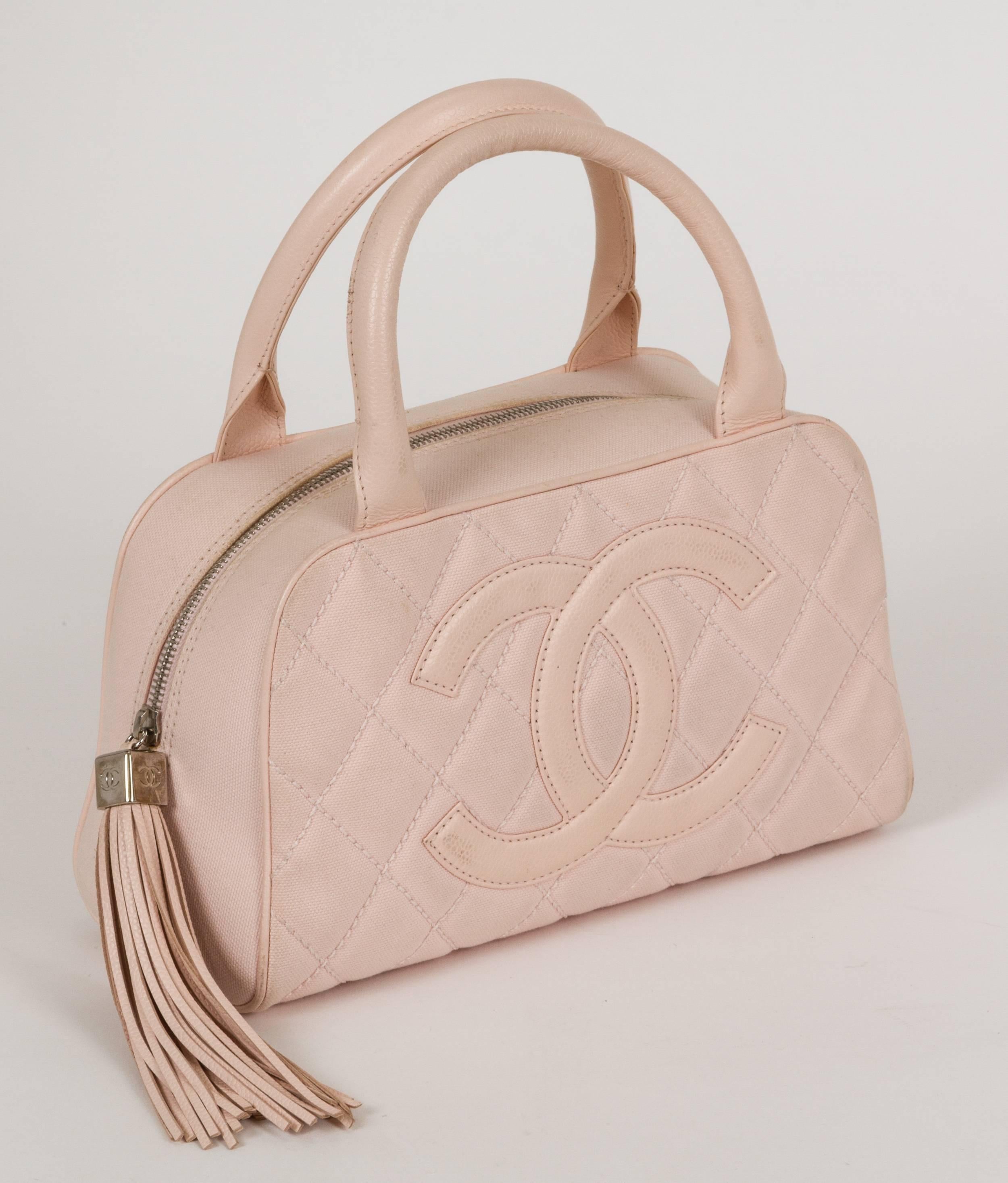Late-1990s Chanel light-pink bowler. Combination of fabric and leather. Very good condition with two minor stains barely visible. Comes with seal and original dust bag.
