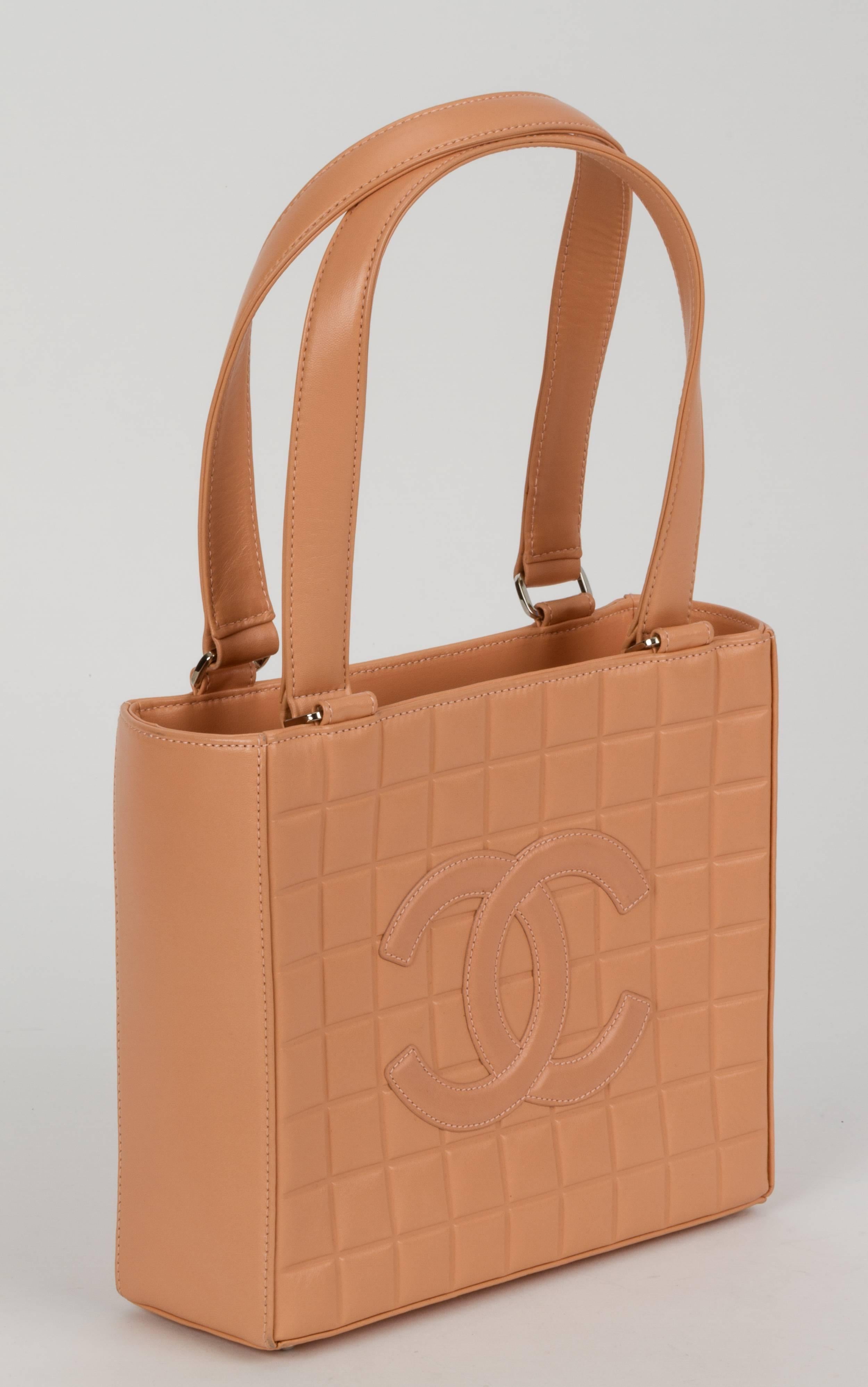 Chanel peach chocolate bar design quilted shoulder tote.Great condition, comes with seal, ID card holder, booklet and dust bag. Handle drop, 9"L.
