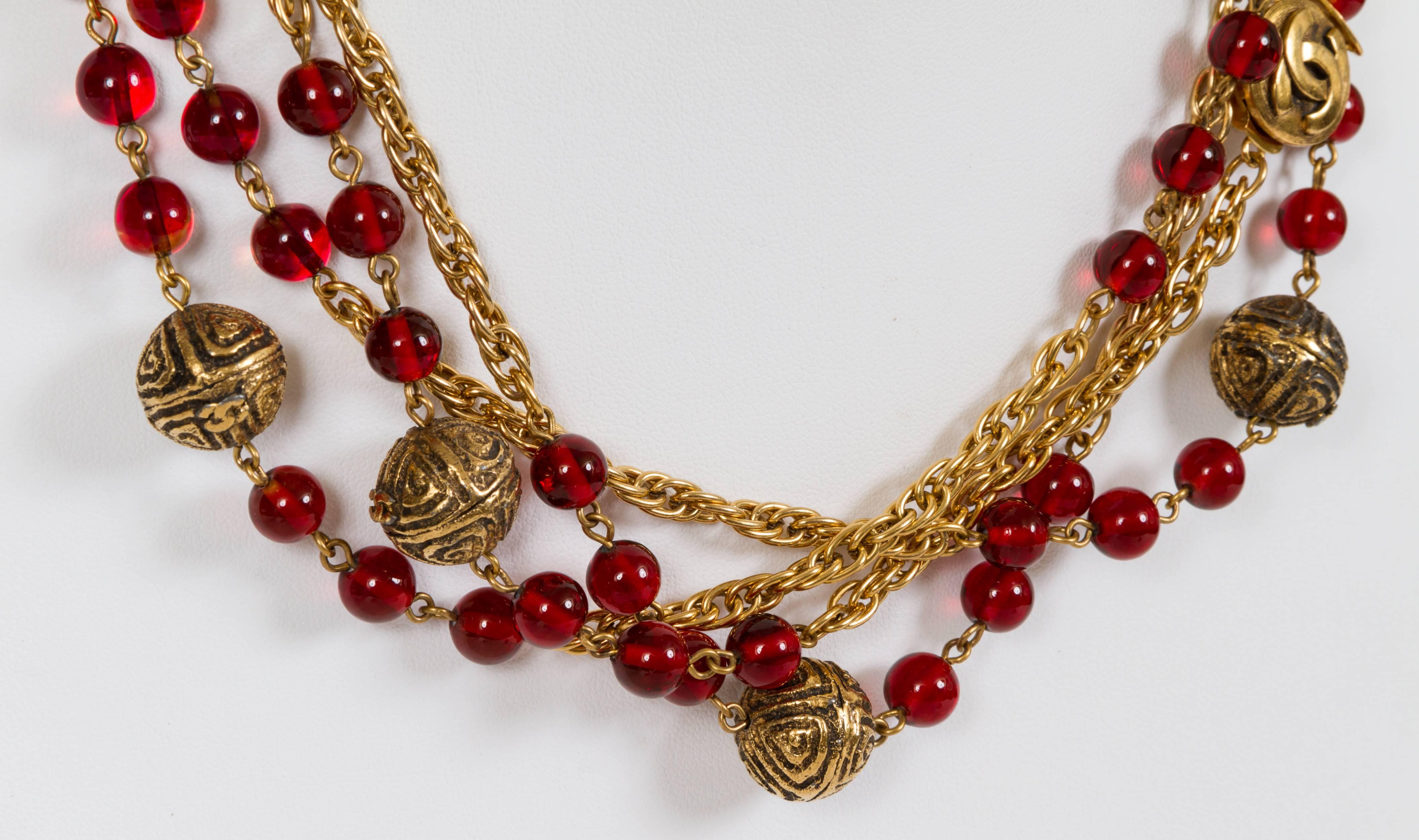 Chanel rare red gripoix cranberry sautoir necklace. Collection 1985. Can be worn up to 4 strands. Comes with original box. Glass stones with 18k plated rhodium. 