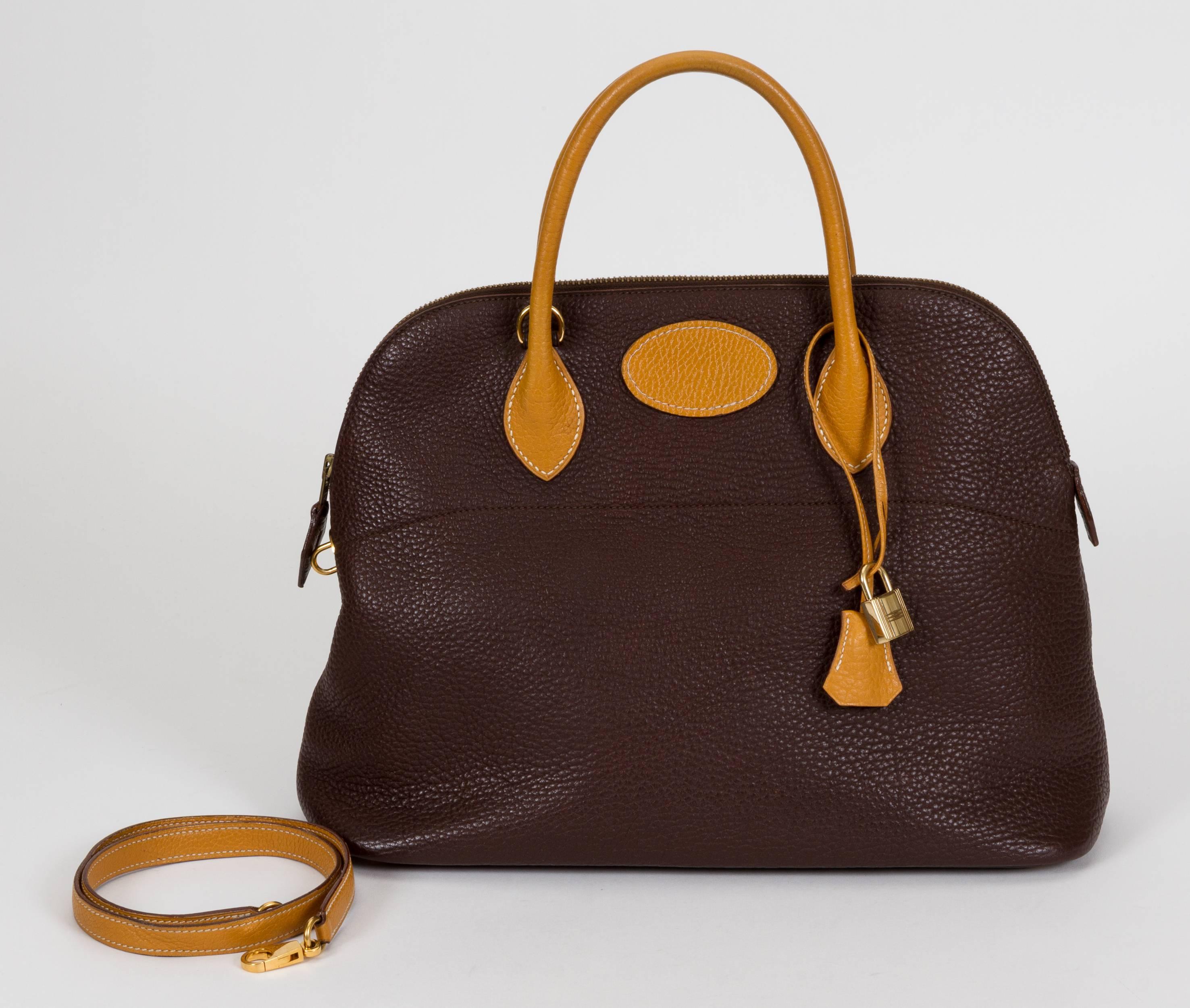 Hermès 35cm Bolide bag in a bicolor combination of brown and natural Togo leather. Handle drop, 4.5