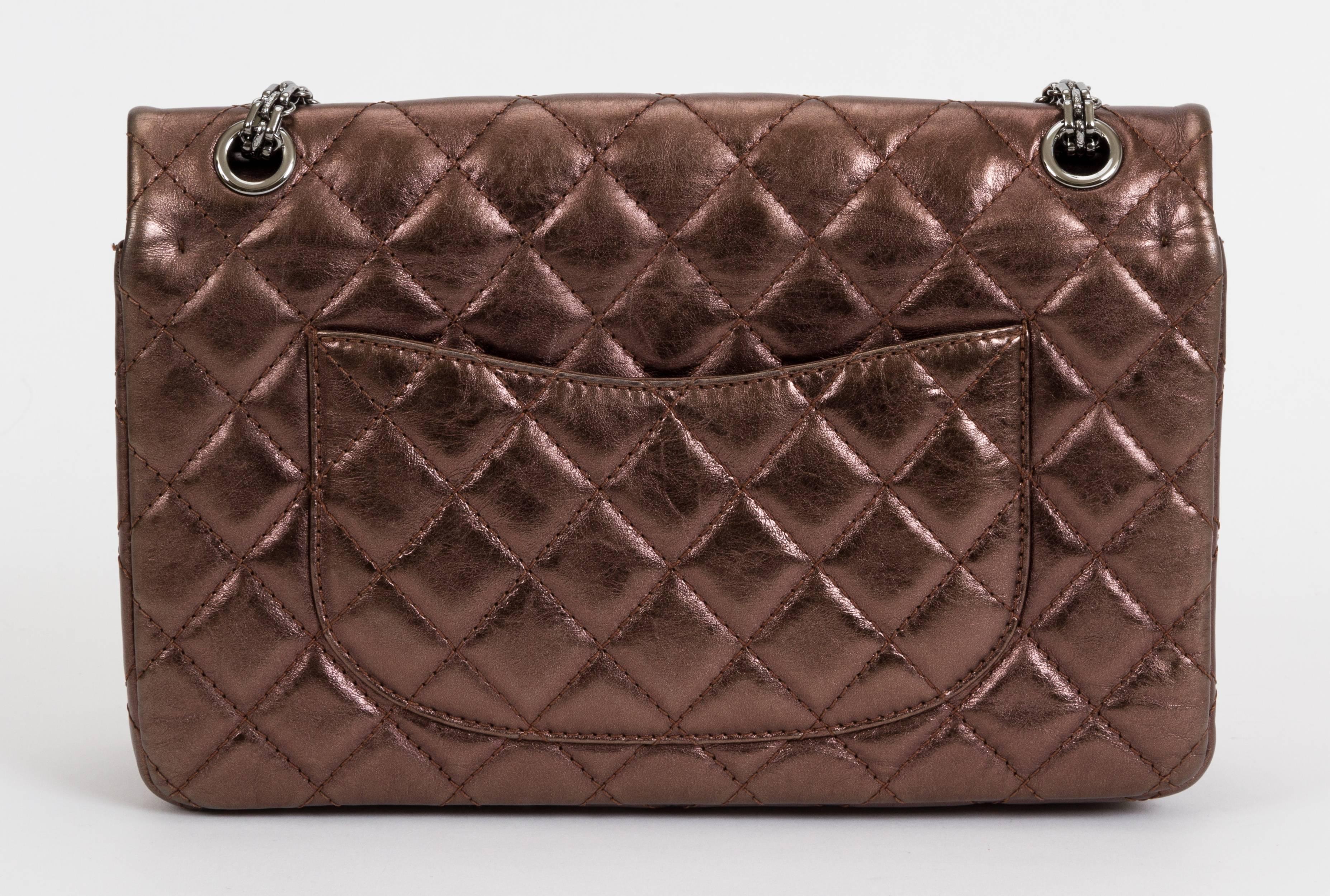 Chanel reissue jumbo double-flap bag in metallic bronze quilted leather with gunmetal hardware. Shoulder drop, 11