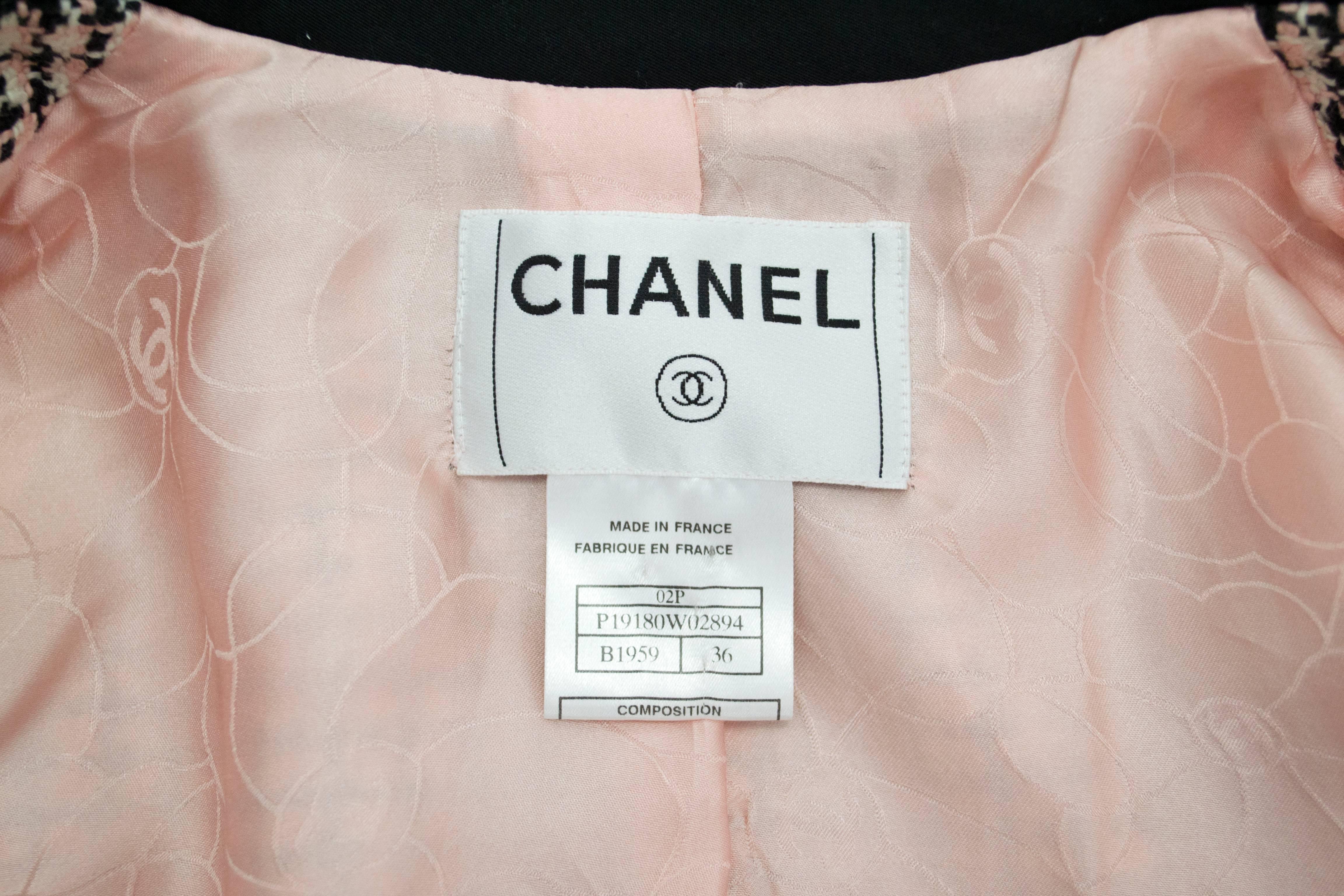 Chanel 2002 Collection. This is a 100% cotton heavier weight jacket, fully lined in silk with signature CC logo. 2 button on front face with 3 buttons at each cuff. Collar is black silk. Very good condition with minor wear due to age. 
