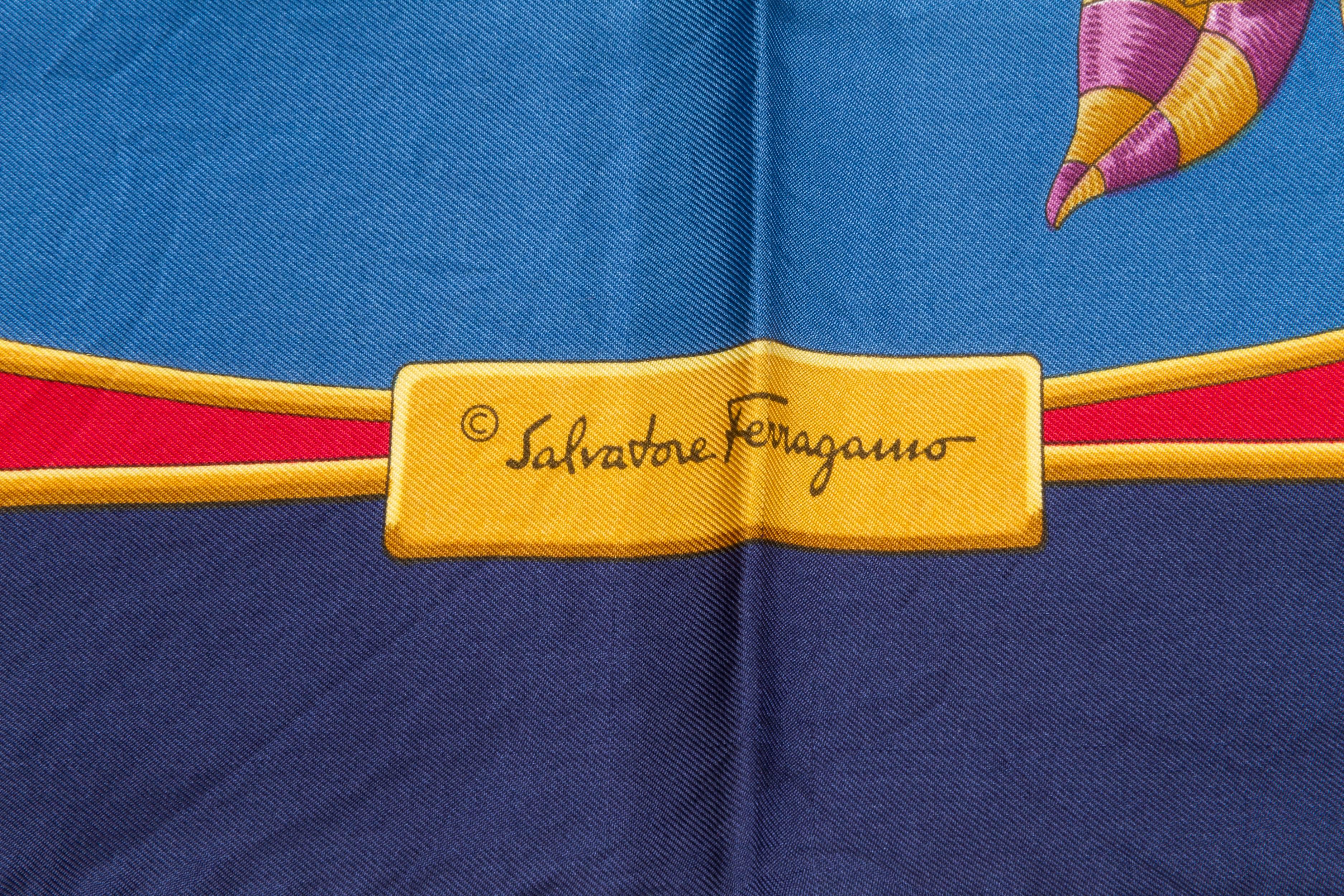 Salvadore Ferragamo silk twill regal gold peacock scarf with hand rolled edges. Very good condition with minor wear. Does not include box. 