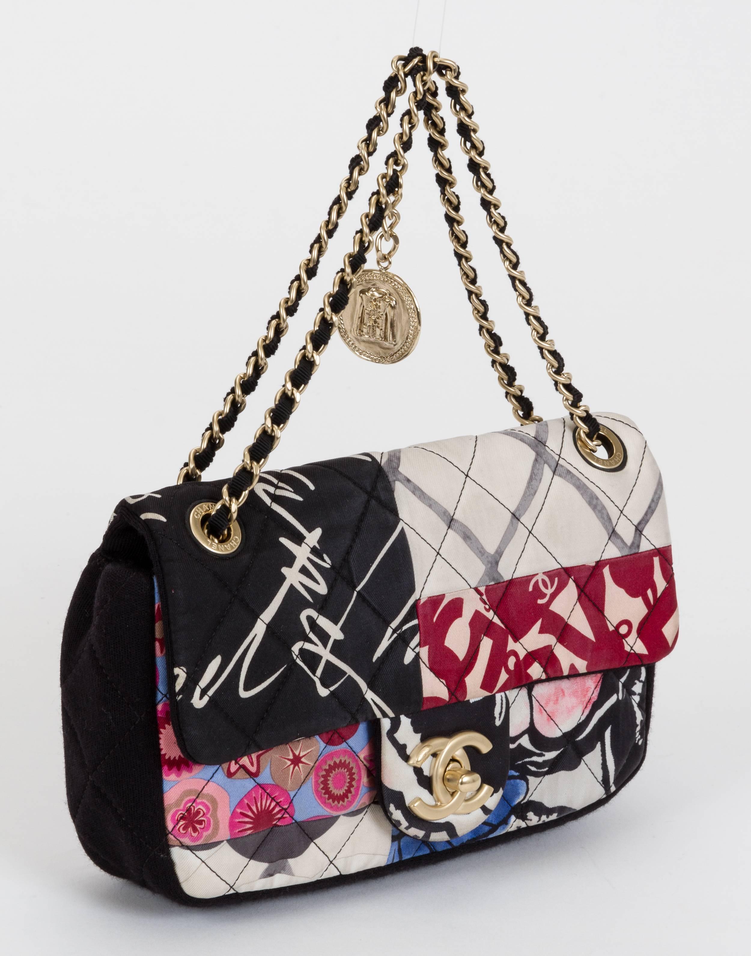 Chanel single-flap cross-body bag in black jersey and multicolored patchwork fabric with coin charm. Drop, 12"L/22"L. Comes with hologram, card, and dust cover. Minor wear.
