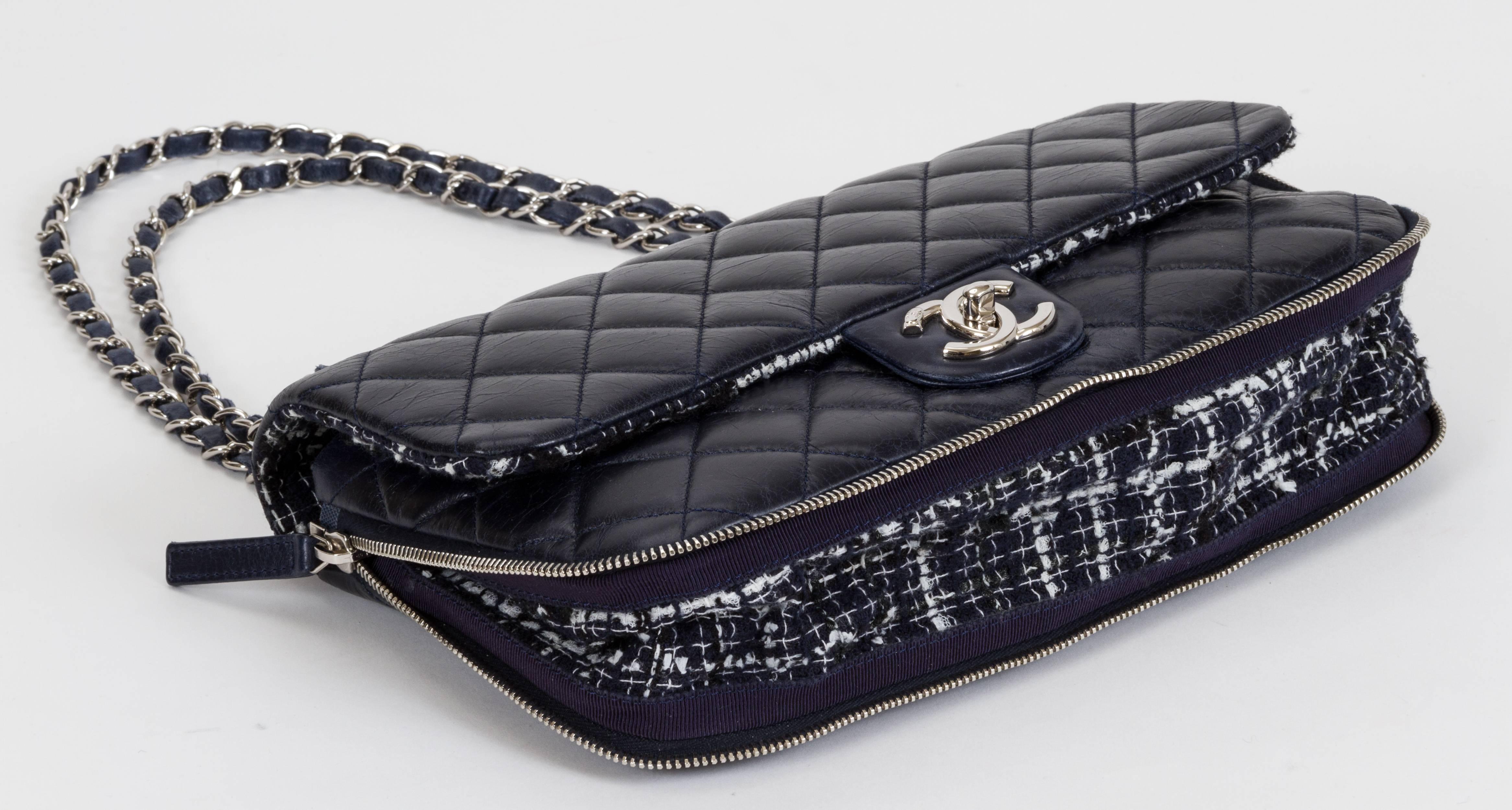 Chanel navy blue distressed leather flap bag with expandable zipper and tweed white-and-blue interior. Partial plastic still on hardware. Comes with hologram, ID card, and dust cover. Strap, 10/18