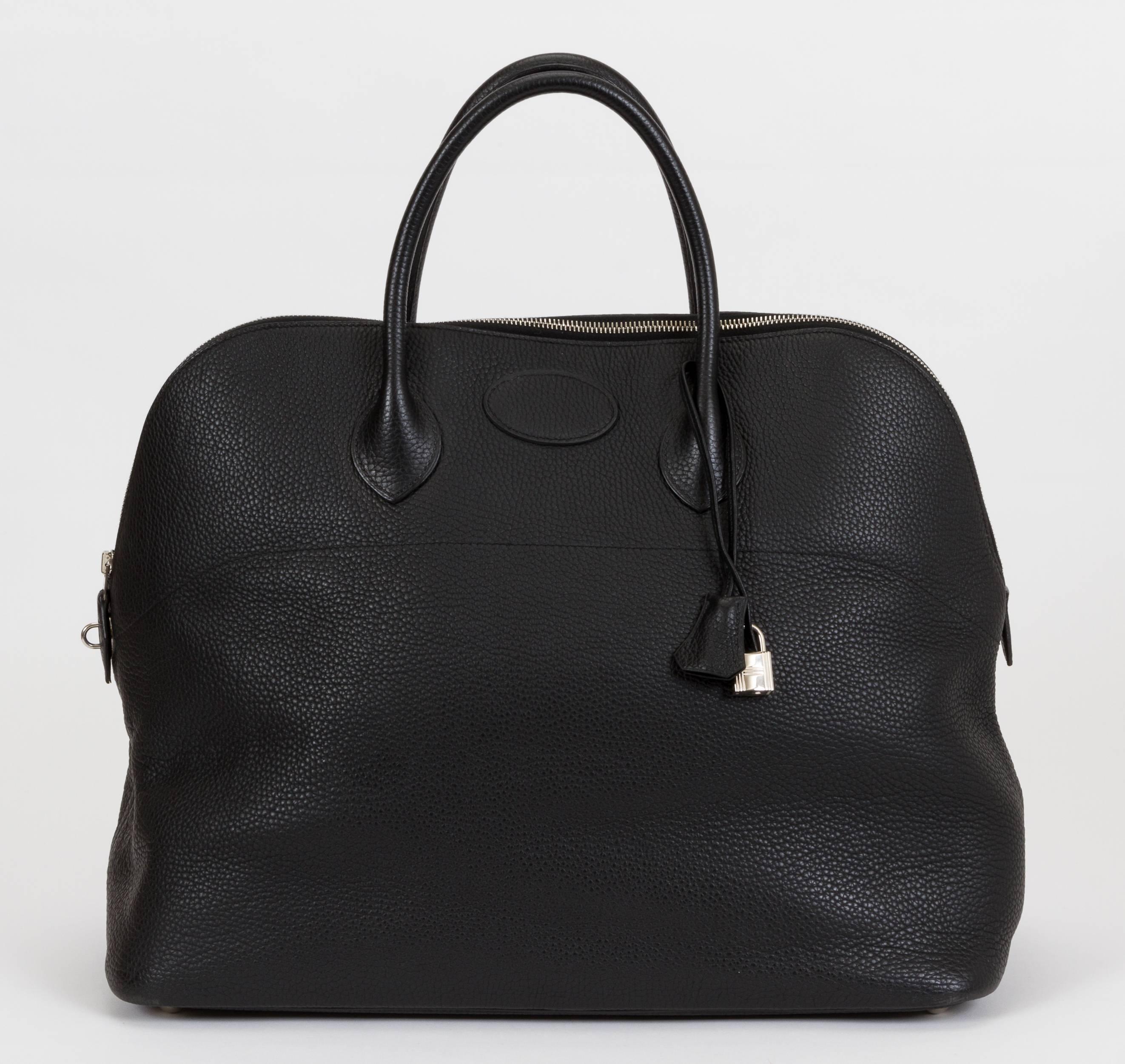 Hermès extra-large travel bolide in black Togo leather with palladium hardware and toile interior. Date stamp J for 2006. Comes with clochette, tirette, and original dust cover. Minor wear.
