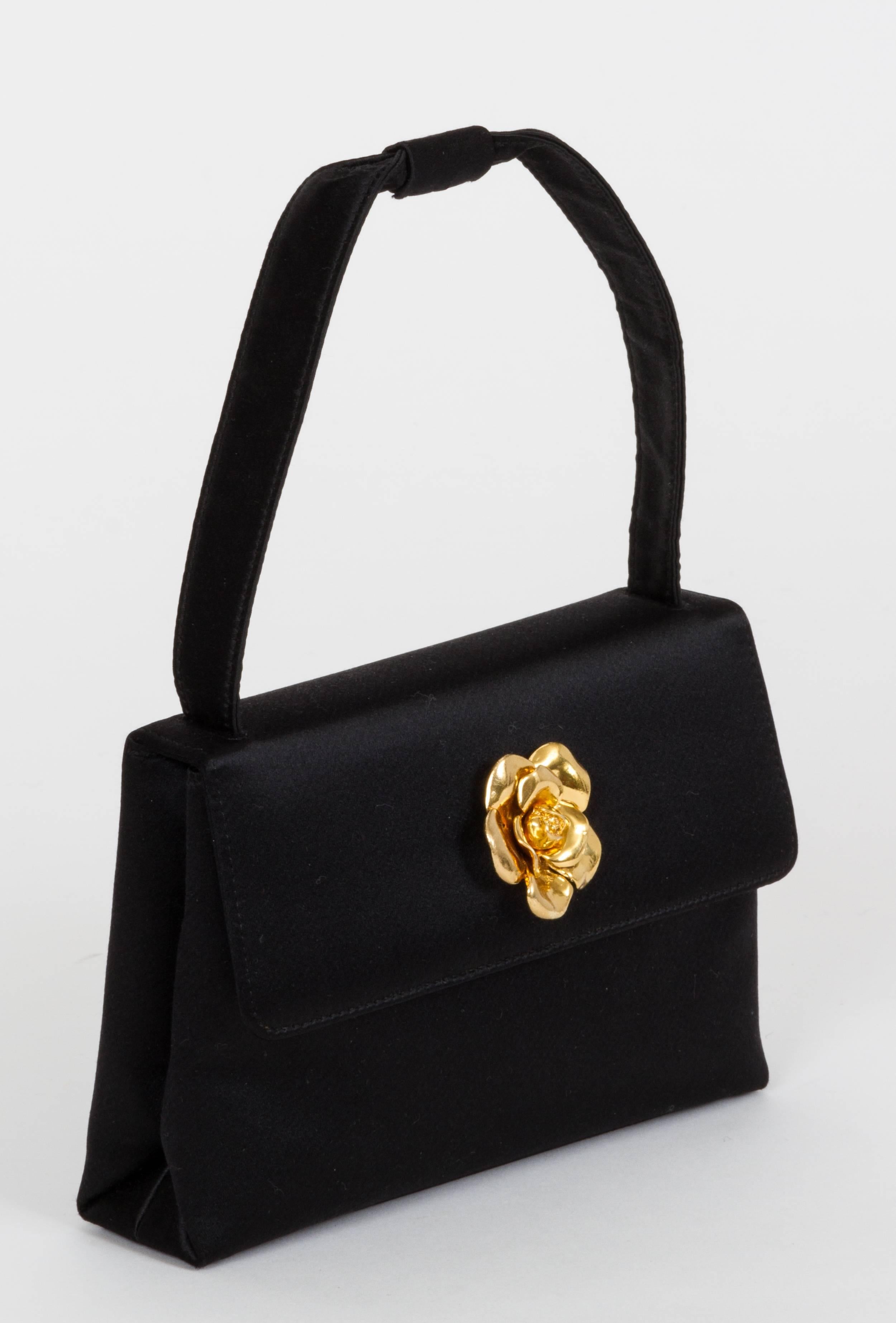 Chanel black satin silk evening bag with gold camellia detail, early 1990s. Handle drop, 5