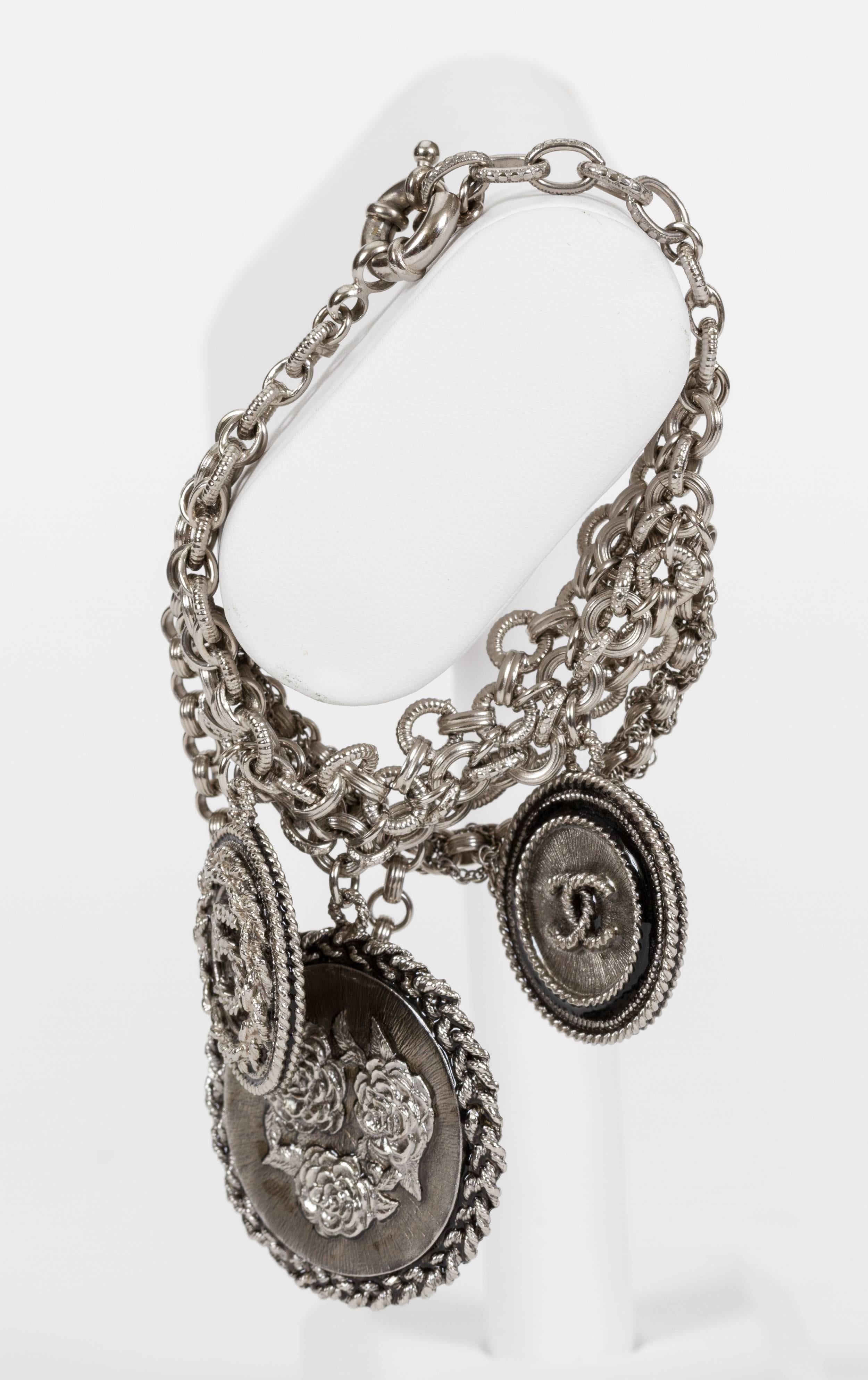 Chanel 100 Yr Anniversary Silver Charm Bracelet In Good Condition In West Hollywood, CA