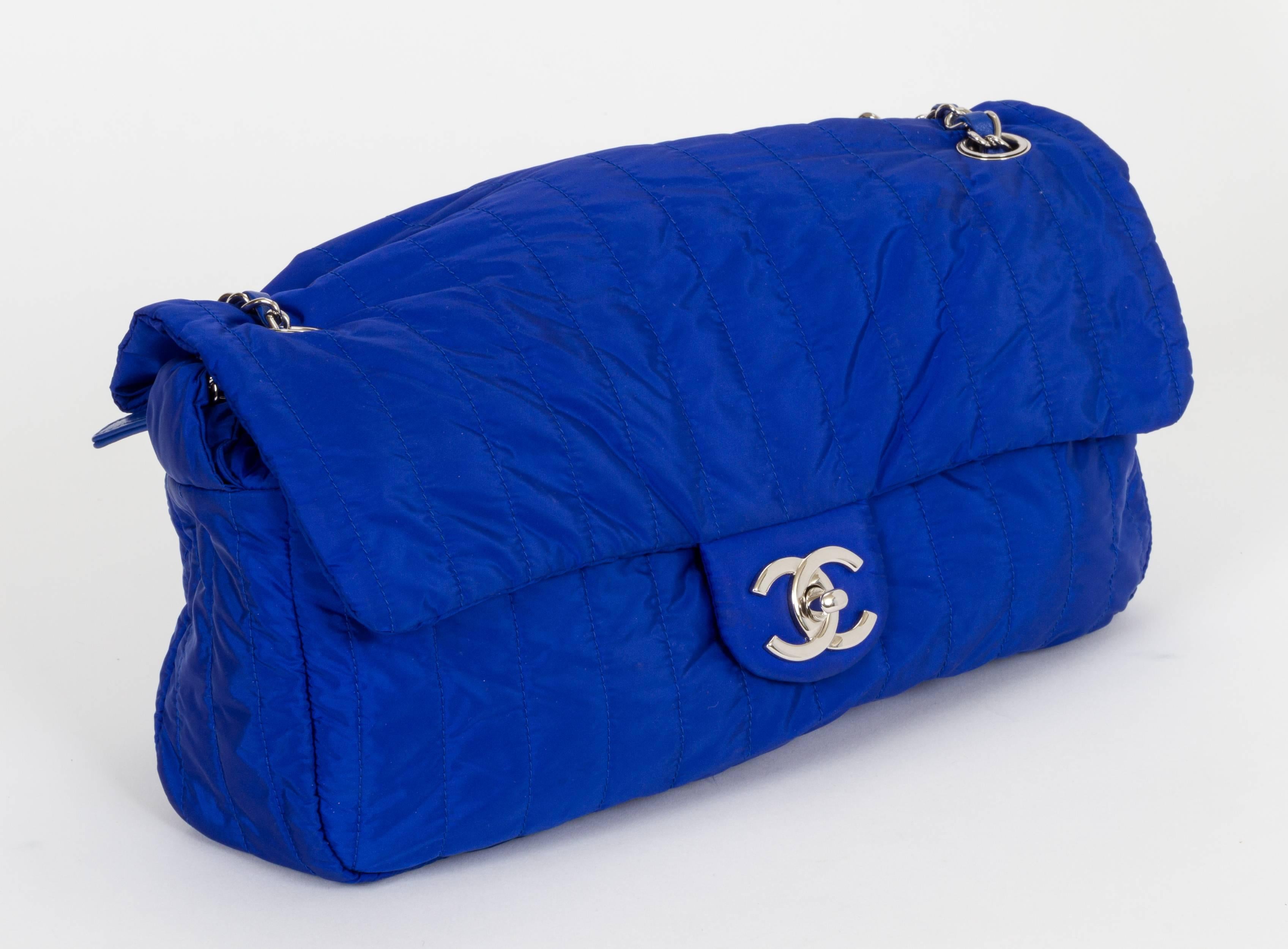Chanel electric blue soft nylon jumbo bag with matching pouchette. Comes with original box. Pouchette, 10