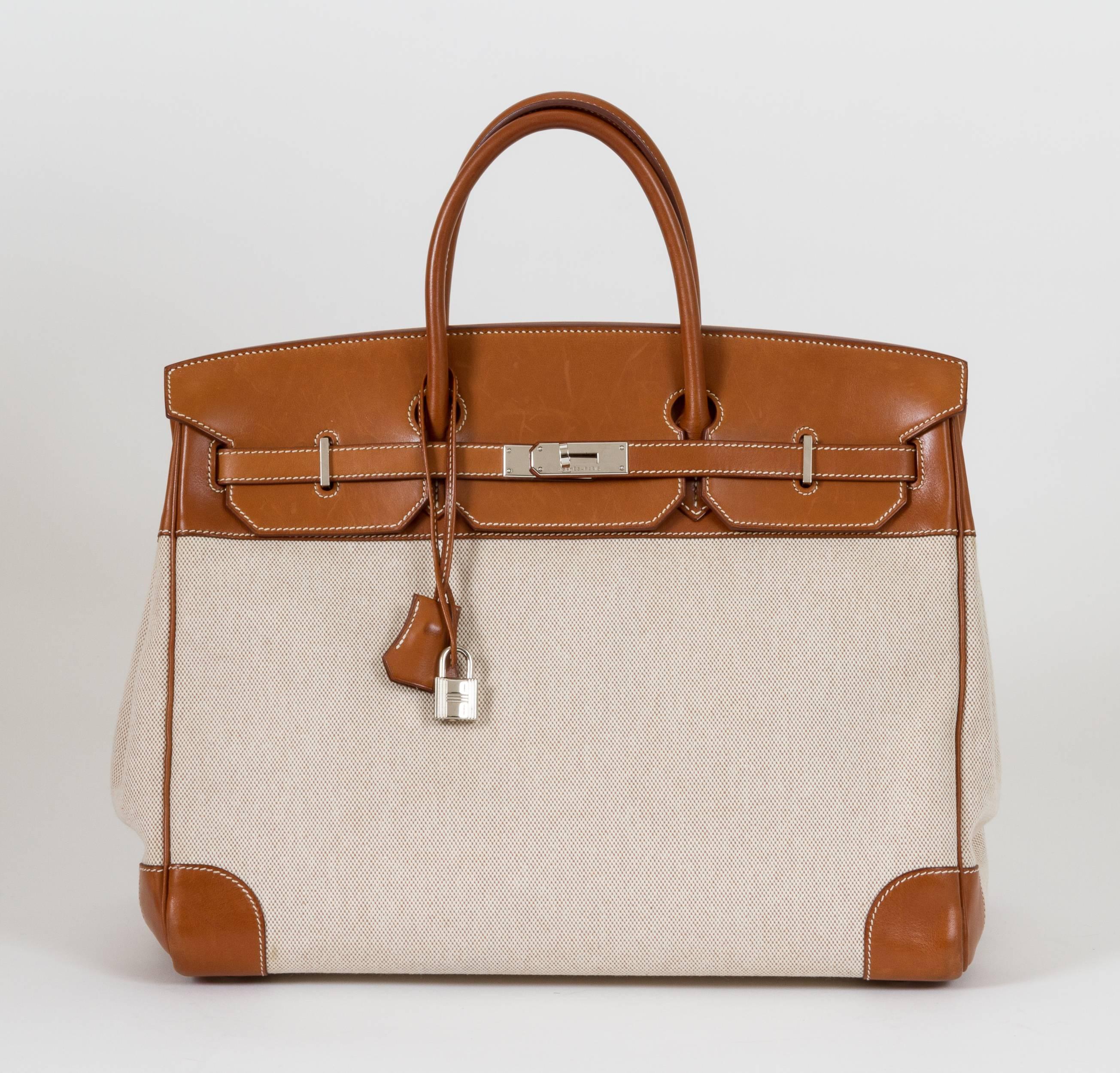 Hermès Birkin 40cm in fauve Barenia leather and beige toile. Barenia is the original leather used by Hermès to build their saddles. Date stamp O for 2011. Handle drop, 5.5