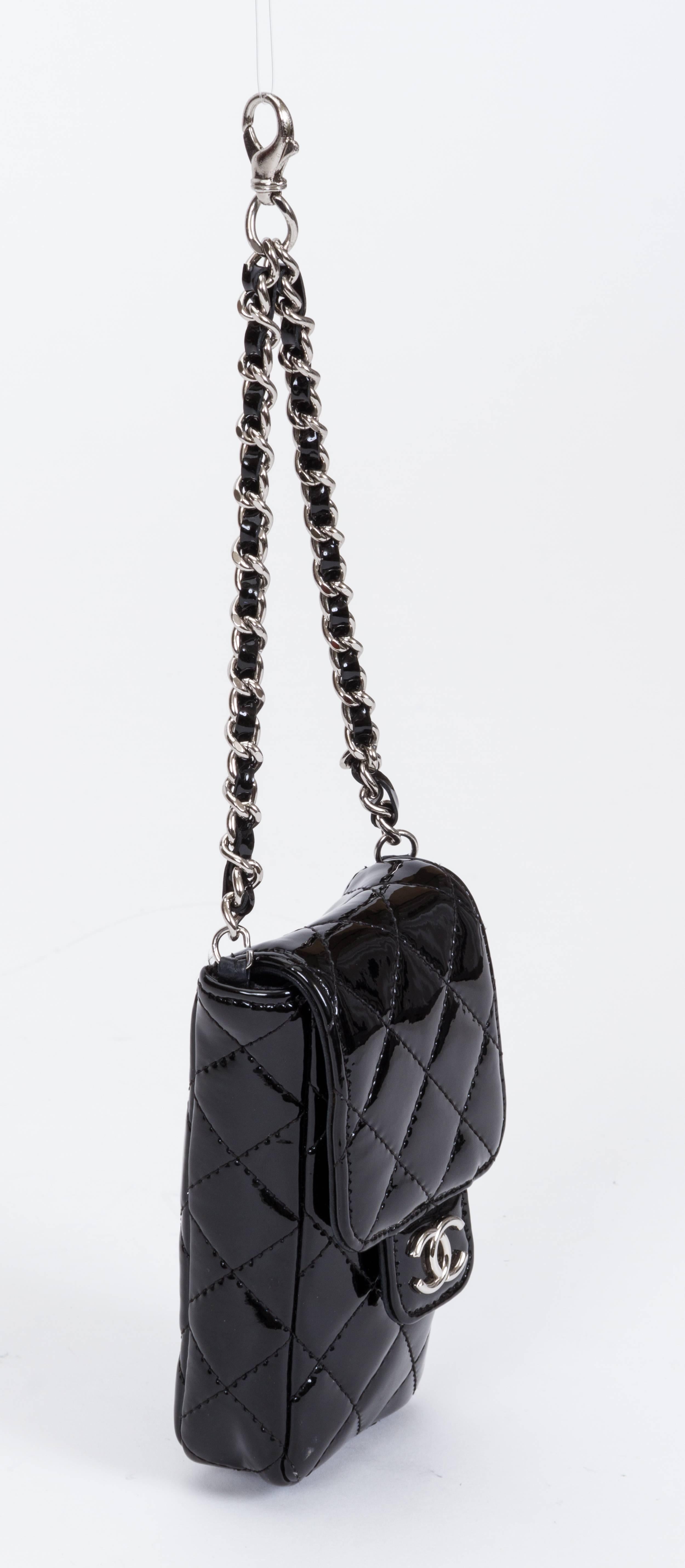 Chanel black patent leather charm purse. Can be attached to a purse or a belt. Cruise collection 2010. Chain drop 5 3/4